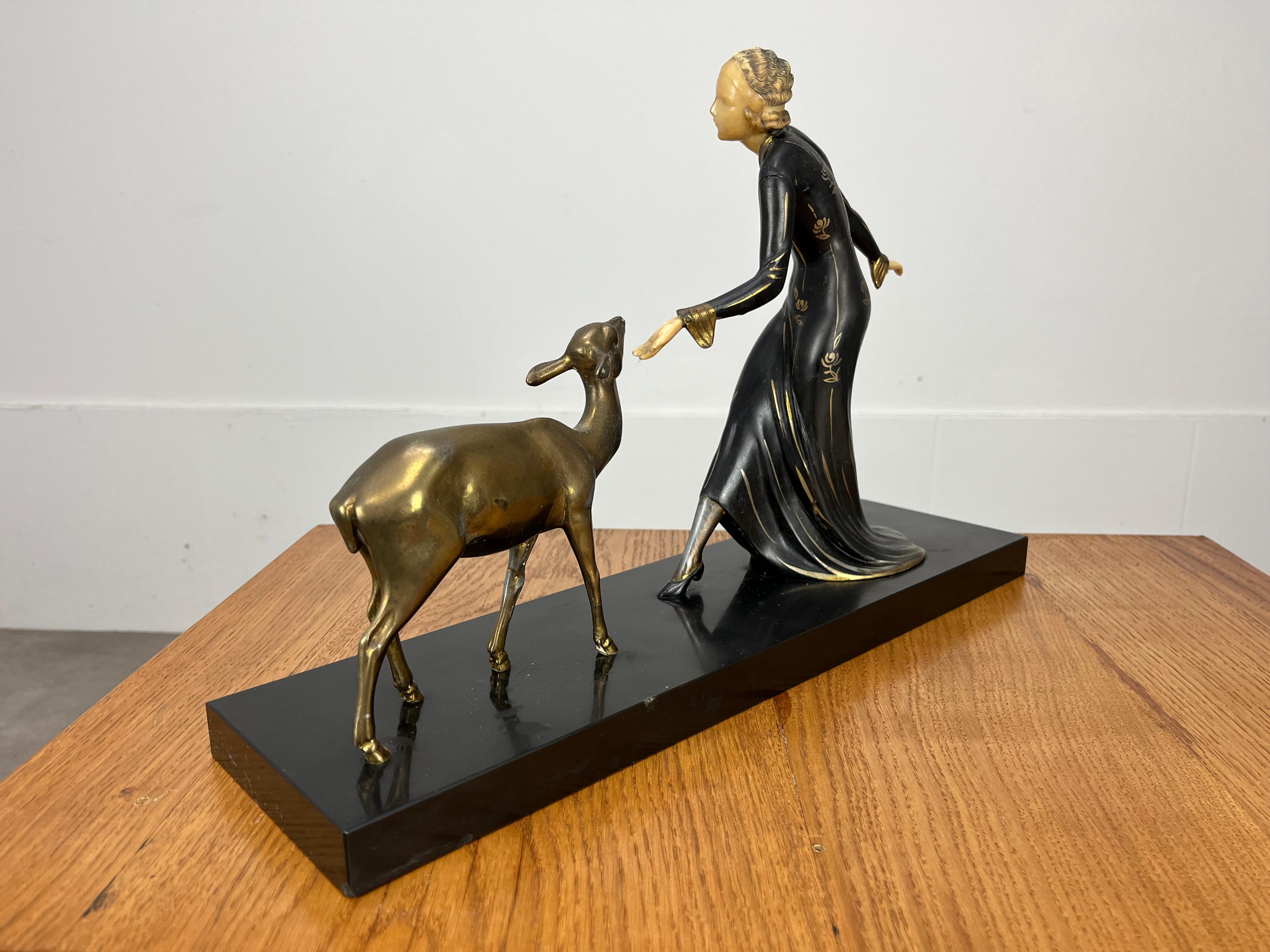 Metal Art Deco Menneville sculpture, woman and fawn, 1930's For Sale