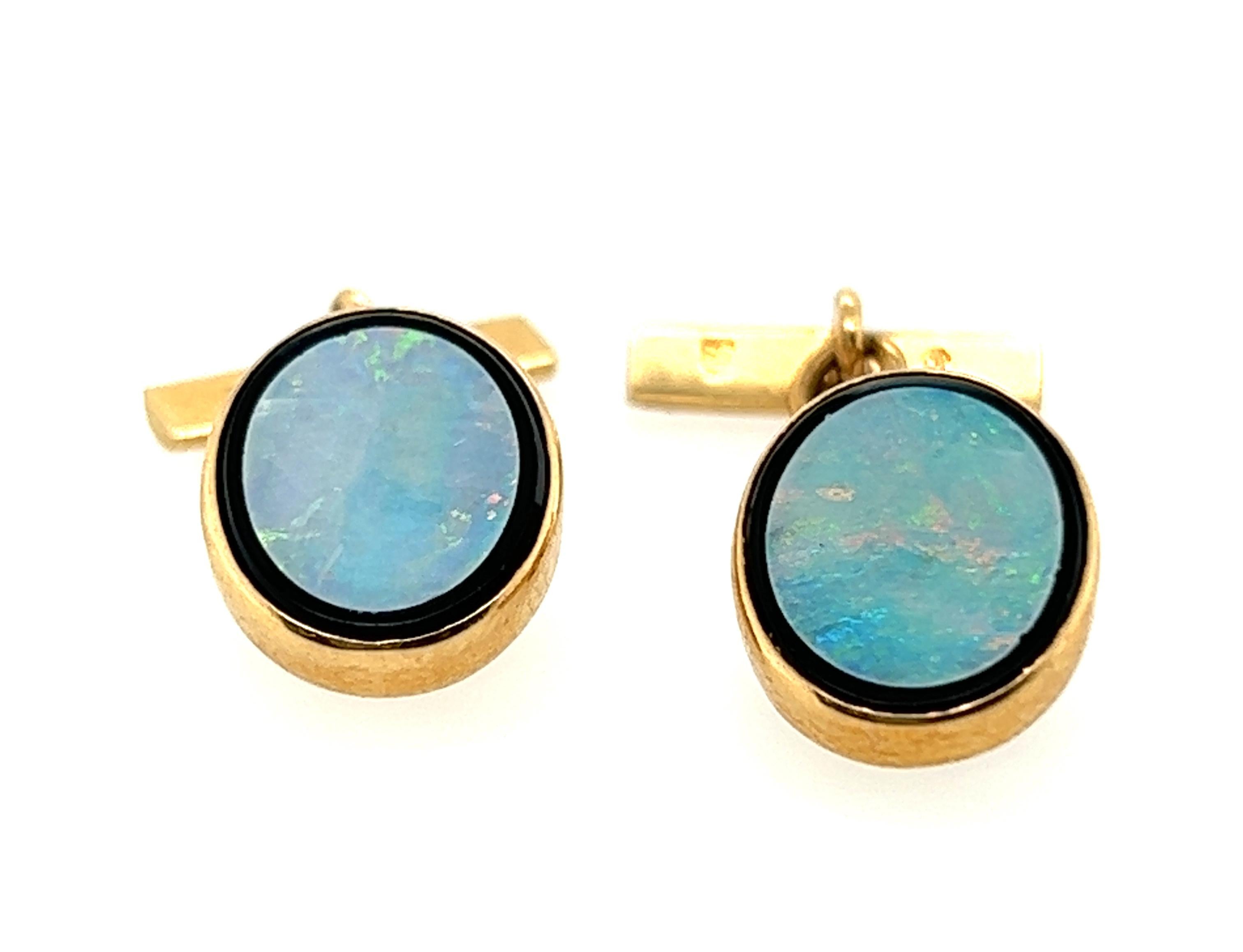Genuine Original Antique from 1930s-1940s Art Deco Mens European Opal Onyx Cufflinks 18K Yellow Gold 


Features Two 10.5 x 8.5mm Oval Cut European Opal Gemstones

Opals are Mounted in Black Onyx Border

These Cufflinks Weigh a Heavy 5.26