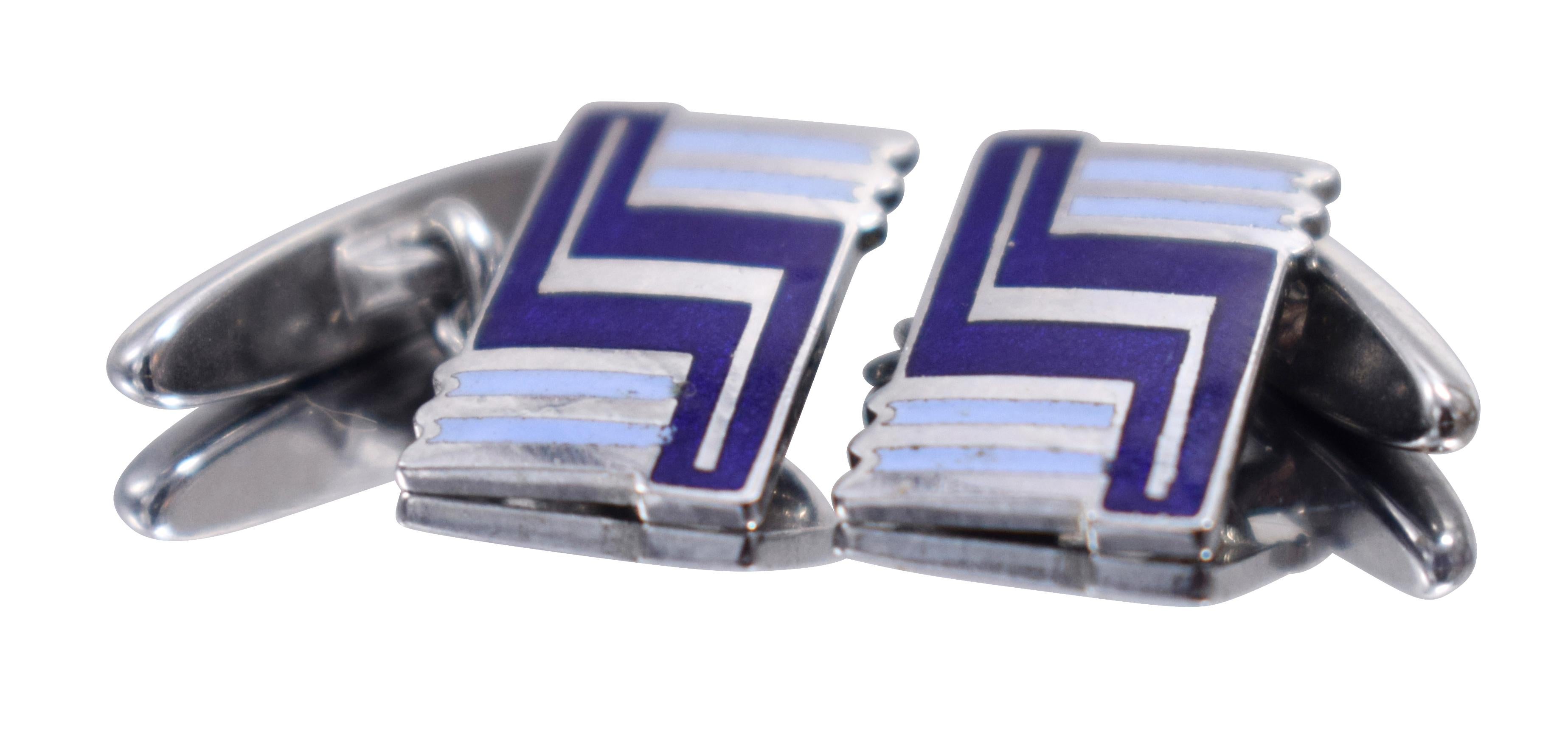 Fabulous pair of matching Art Deco men’s cufflinks with a great geometric pattern. Silver toned metal with blue enamel decoration and dating to the 1930's. Condition is great with no wear at all. Ideal for the modern dapper gentleman. 
All our