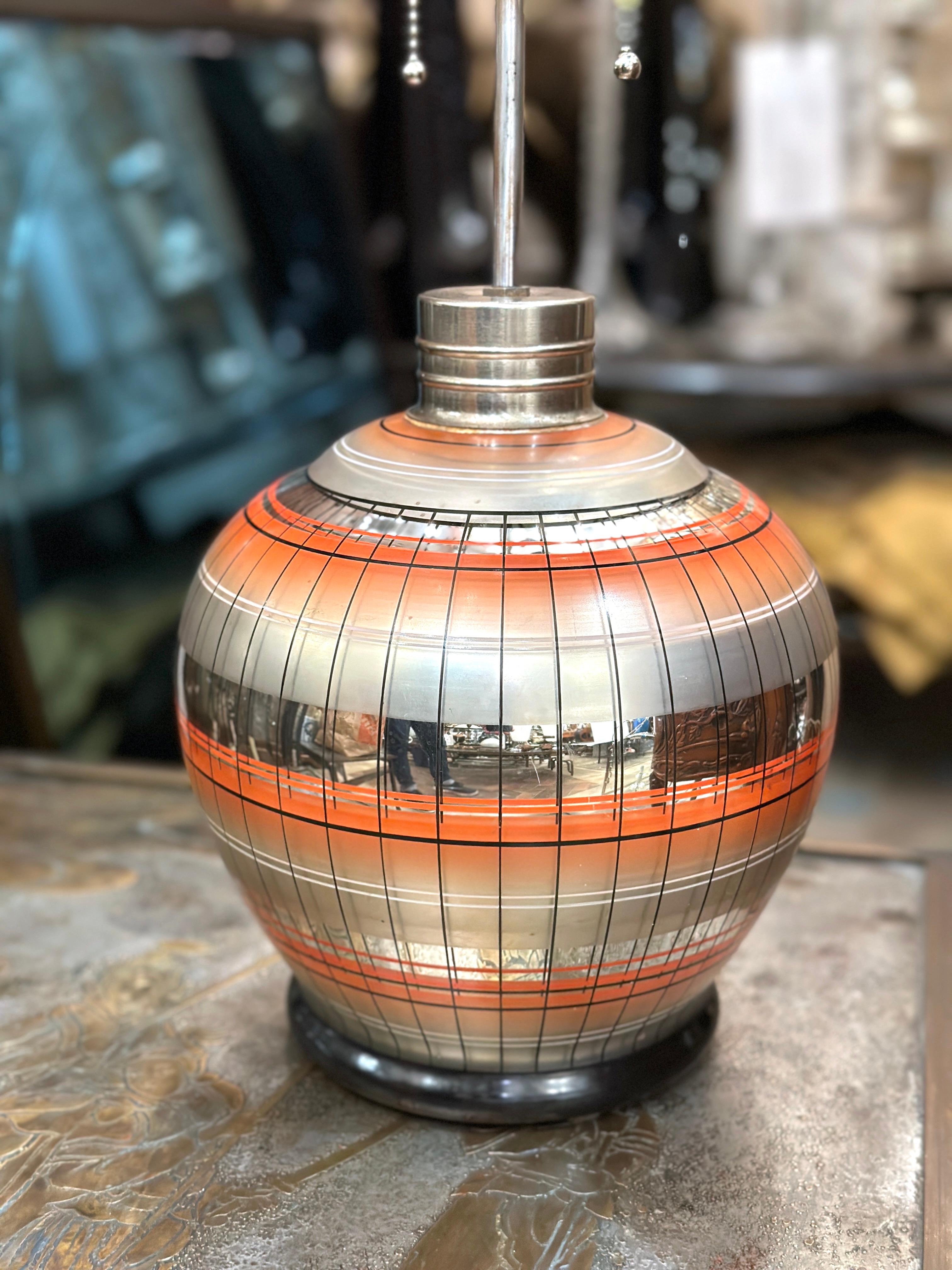 A single circa 1930's Austrian mercury glass lamp with orange details.

Measurements:
Height of body: 10