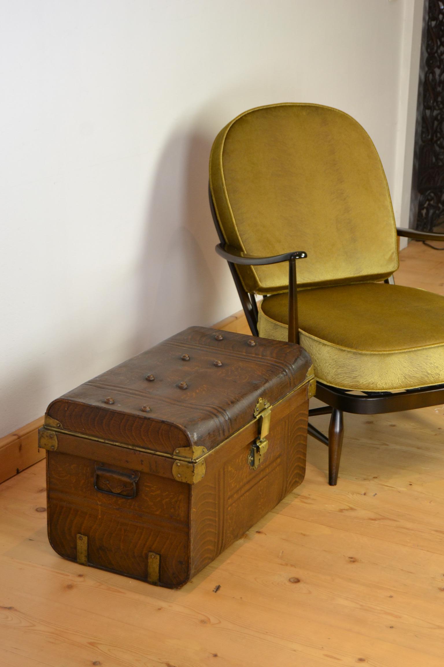 Stylish metal travel trunk with brass lock, corner brackets and details.
This brown hand painted metal trunk or suitcase dates circa 1930s.
It' an English antique metal storage box or travelling trunk with blue interior.
This floor trunk or steel