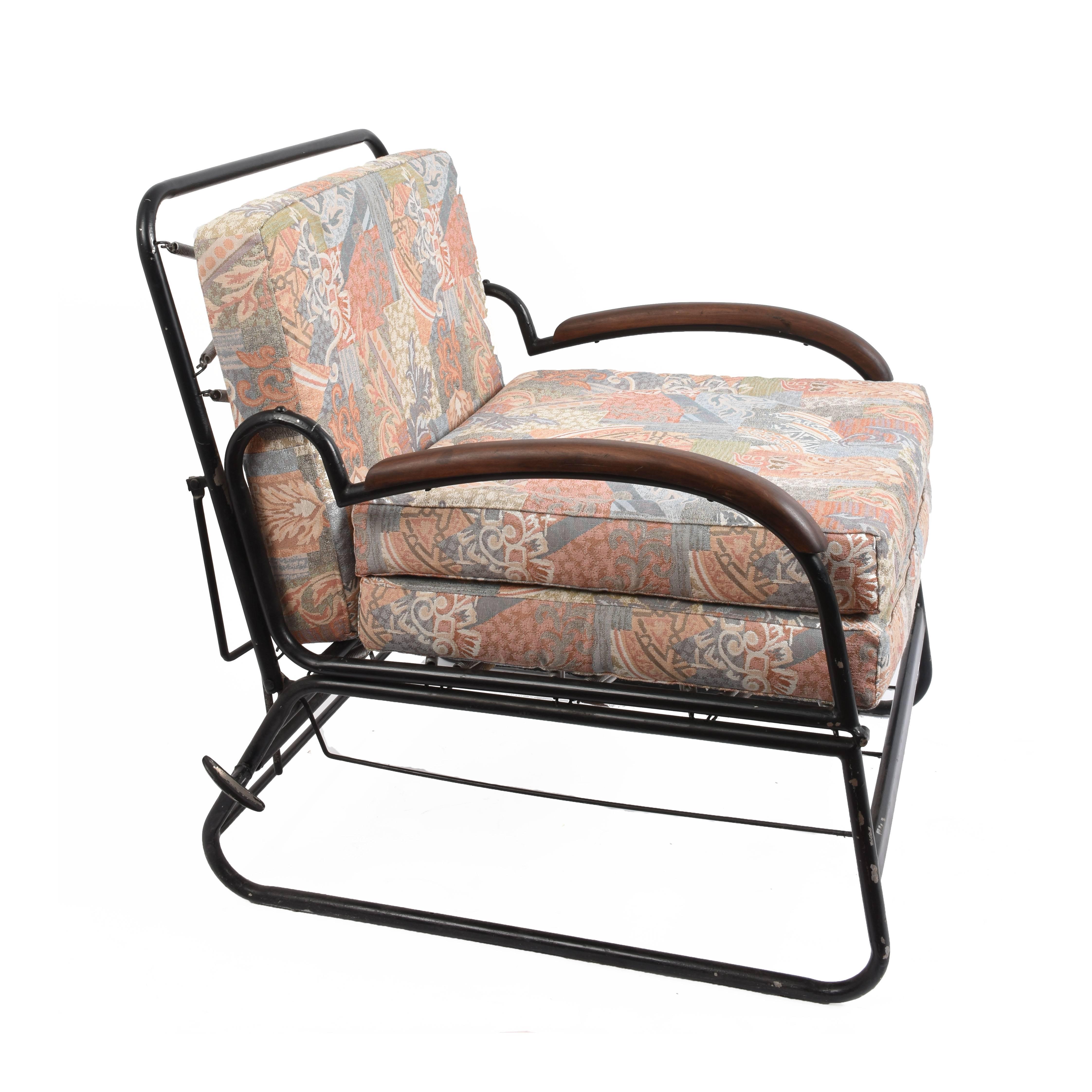 Wonderful adjustable Art Deco bed armchair in curved metal with wooden armrests. 

It can be used as an armchair or a bed and its lines and design it is clearly inspired by Marcel Breuer.

Published in 