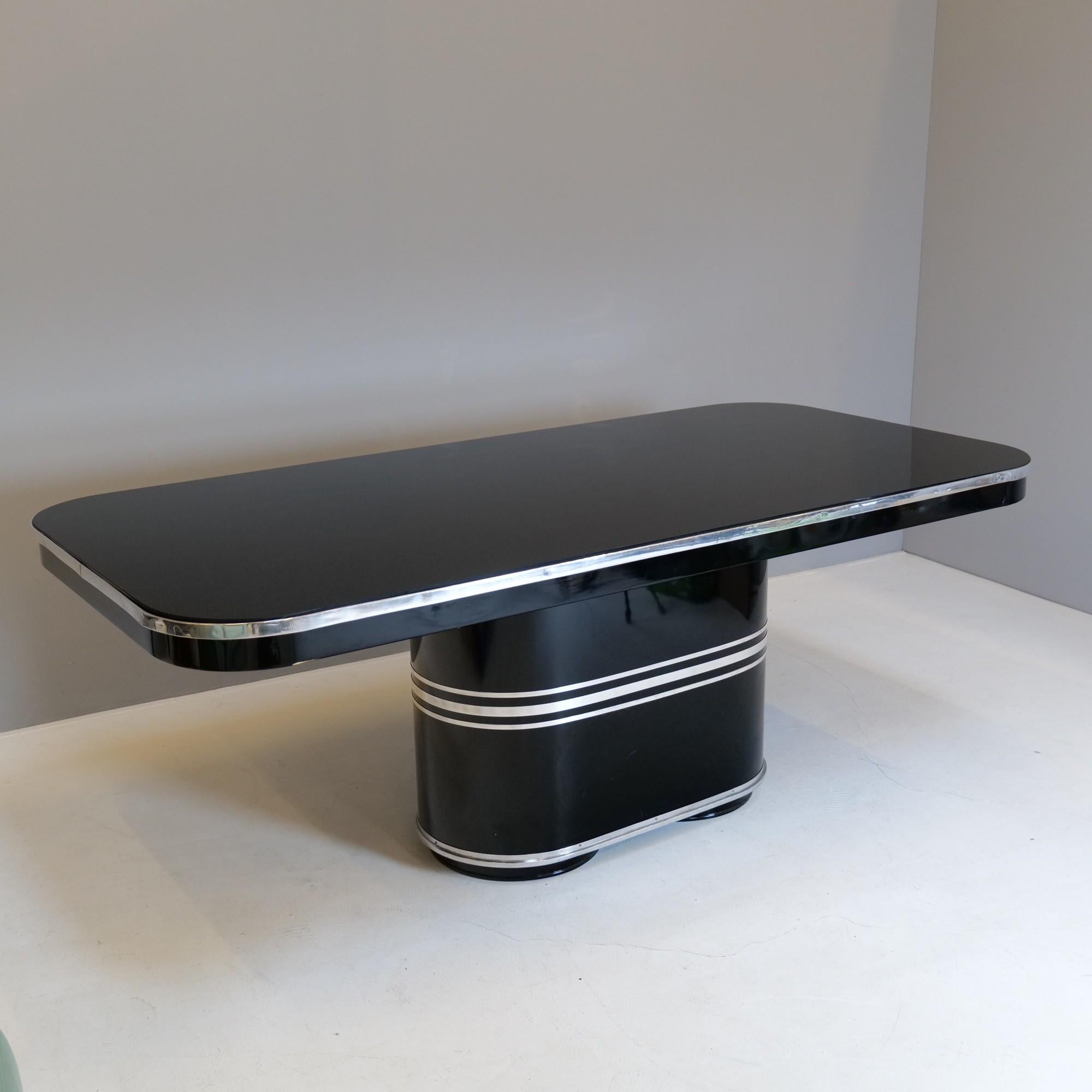 This exceptional streamlined dining table with streamline design is fully made of metal and glass top, which can be every time replaced.
This rare model named 