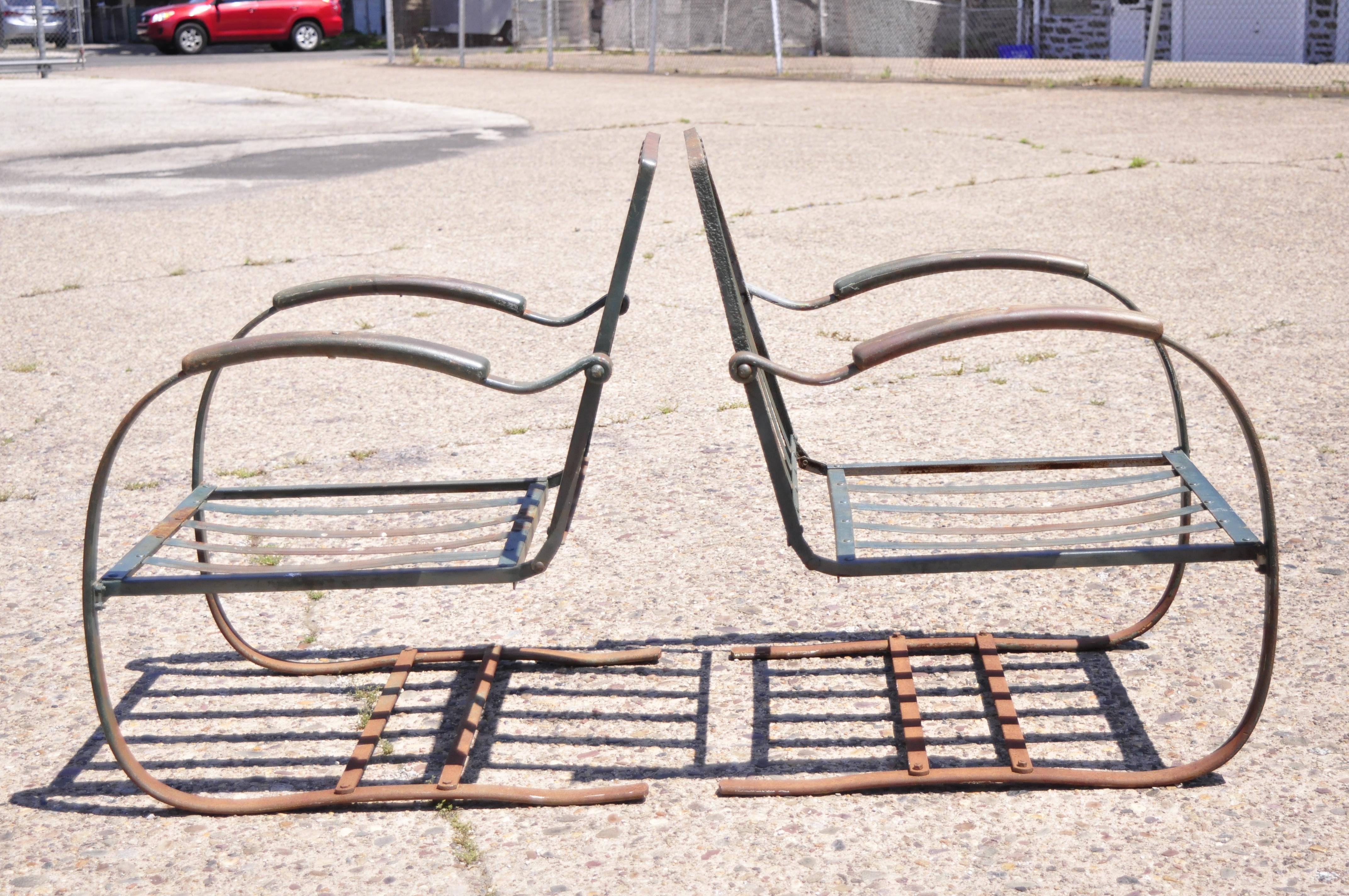 Antique Art Deco steel metal wrought iron green patio garden bouncer lounge chairs, a pair. Item features heavy steel and iron metal frames, green painted distressed finish, very nice antique pair, quality American craftsmanship, great style and