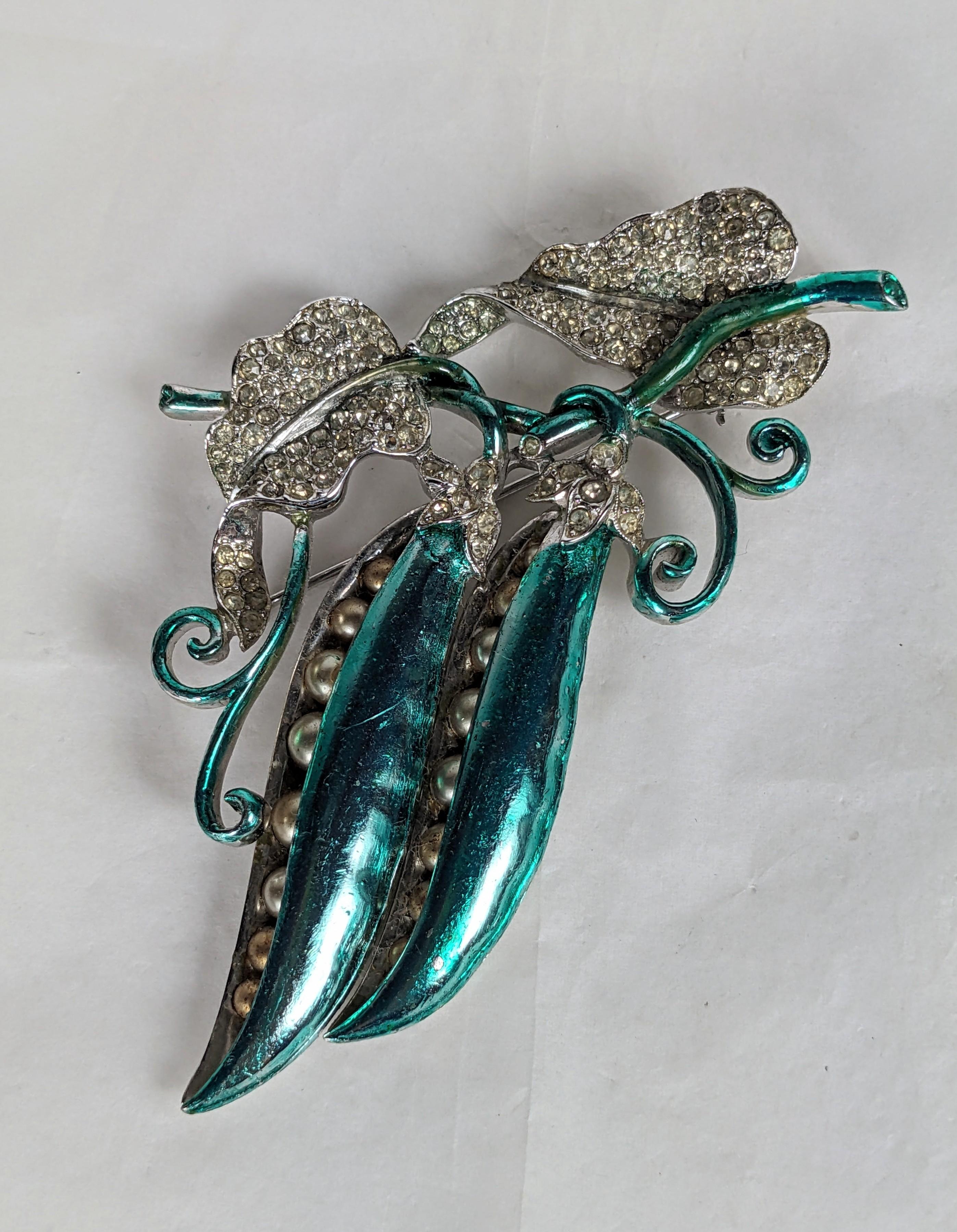 Large and Rare Art Deco Metallic Enamel Pea Pod Brooch from the 1930's likely by Marcel Boucher. Beautifully crafted on rhodium base with fine pave crystal worked leaves and faux pearls as tiny peas. Unsigned, attributed Marcel Boucher. 1930's USA.