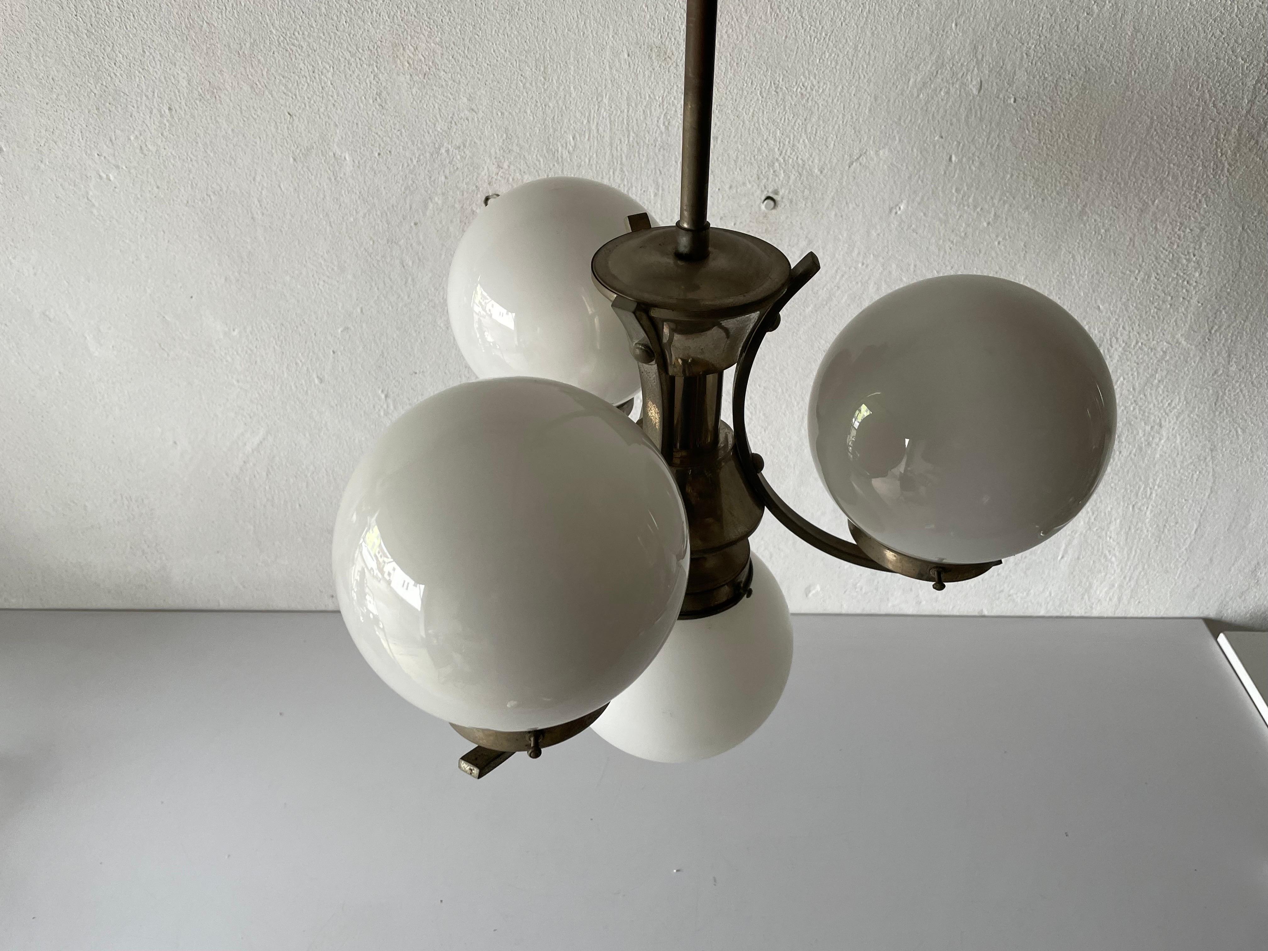 Art Deco metallic silver 4 balls ceiling lamp, 1940s, Germany

Lampshade is in good condition and very clean. 
This lamp works with 4 x E27 light bulb. 
Wired and suitable to use with 220V and 110V for all countries.

Measures: 

Height: 65