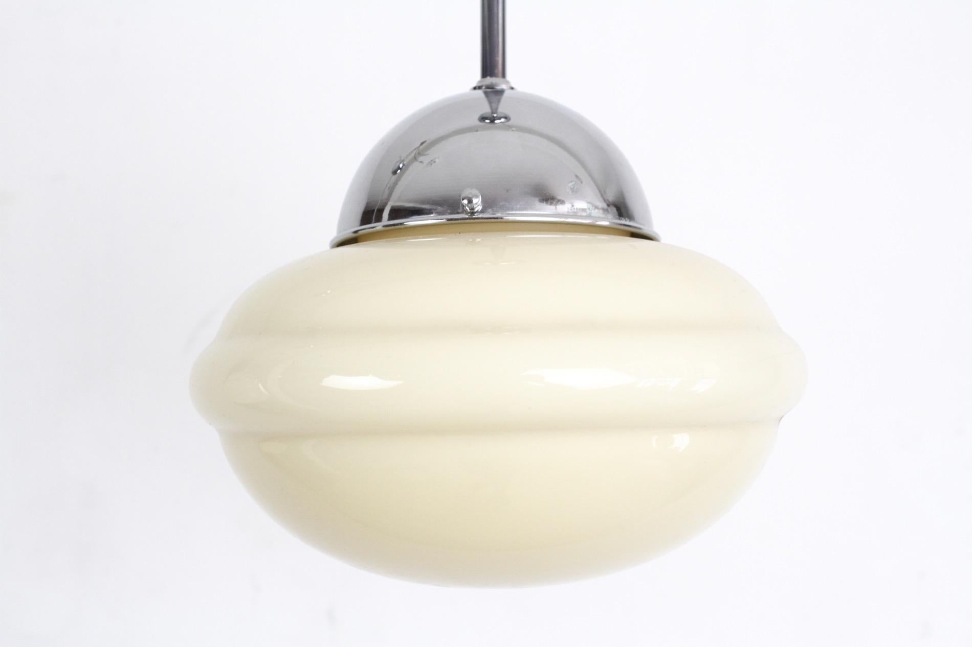 A very special Art Deco glass pendant, look like delicious candy hanging from the ceiling. It was produced in the 1930s, but it is in amazing condition after we restored all chrome-plated parts, fitted with one E27 bulb.