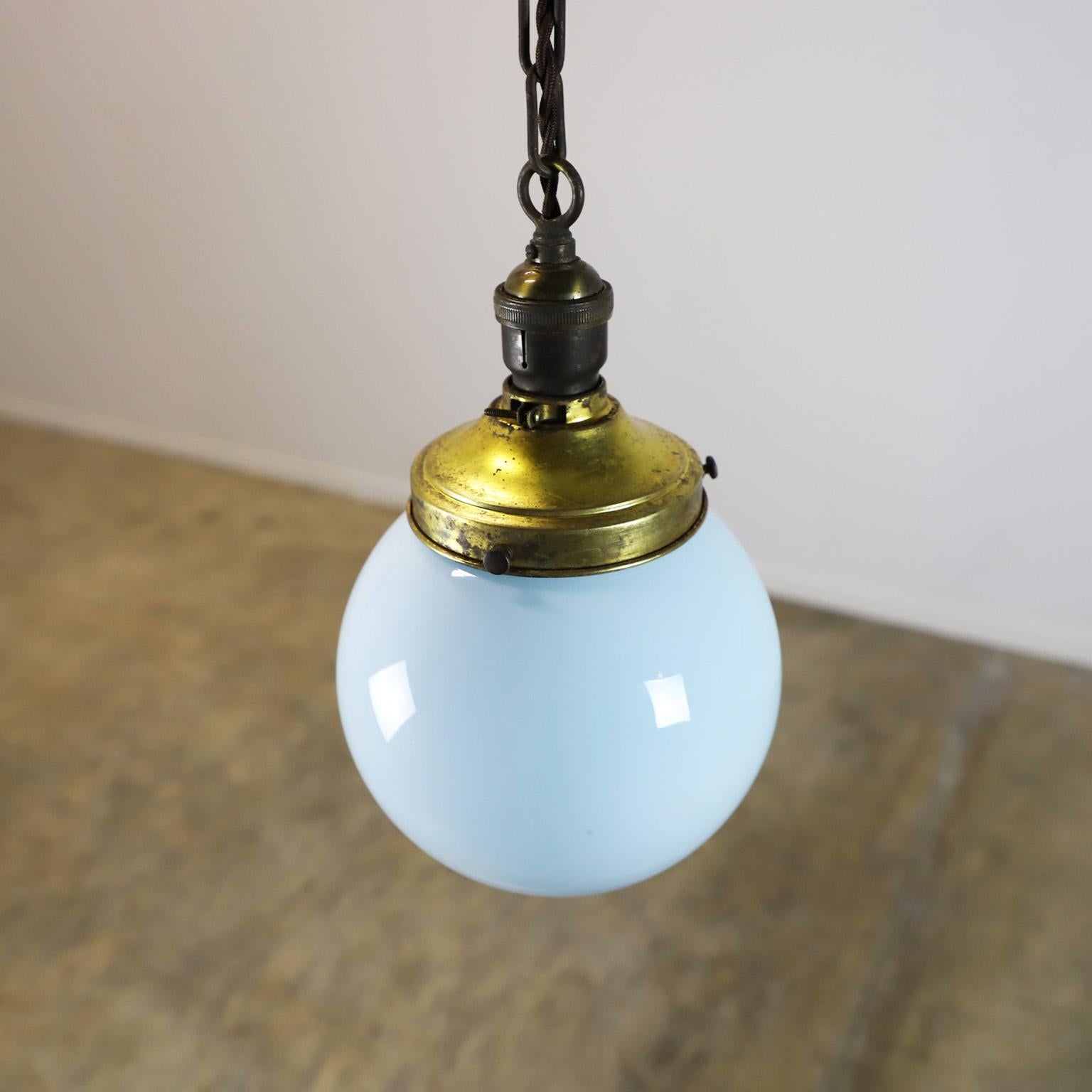 Circa 1930. We offer this Art Deco pendant light made in milk glass circular shade rare blue color. Great patina and excellent vintage conditions.