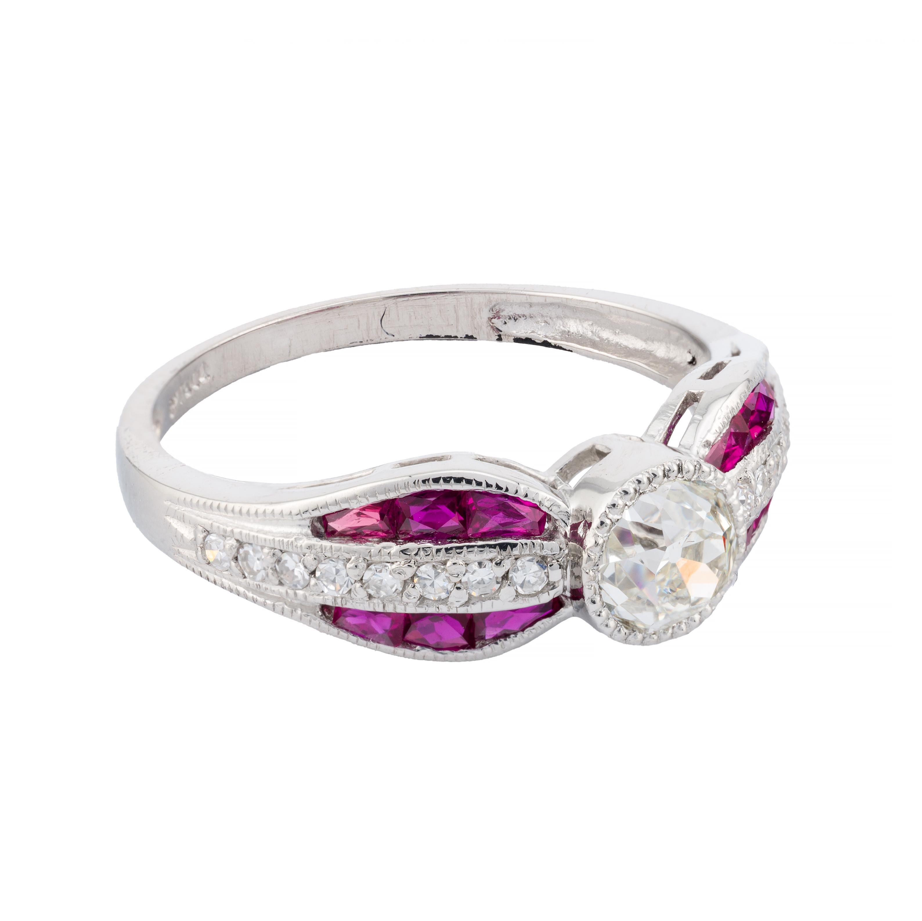 Aston Estate Jewelry Presents:

An elegant engagement ring featuring a 0.62-carat old mine-cut diamond, with a clarity of VS2 and a color grade of I. The diamond is set in a refined platinum mounting in the shape of a bow, complemented by vibrant