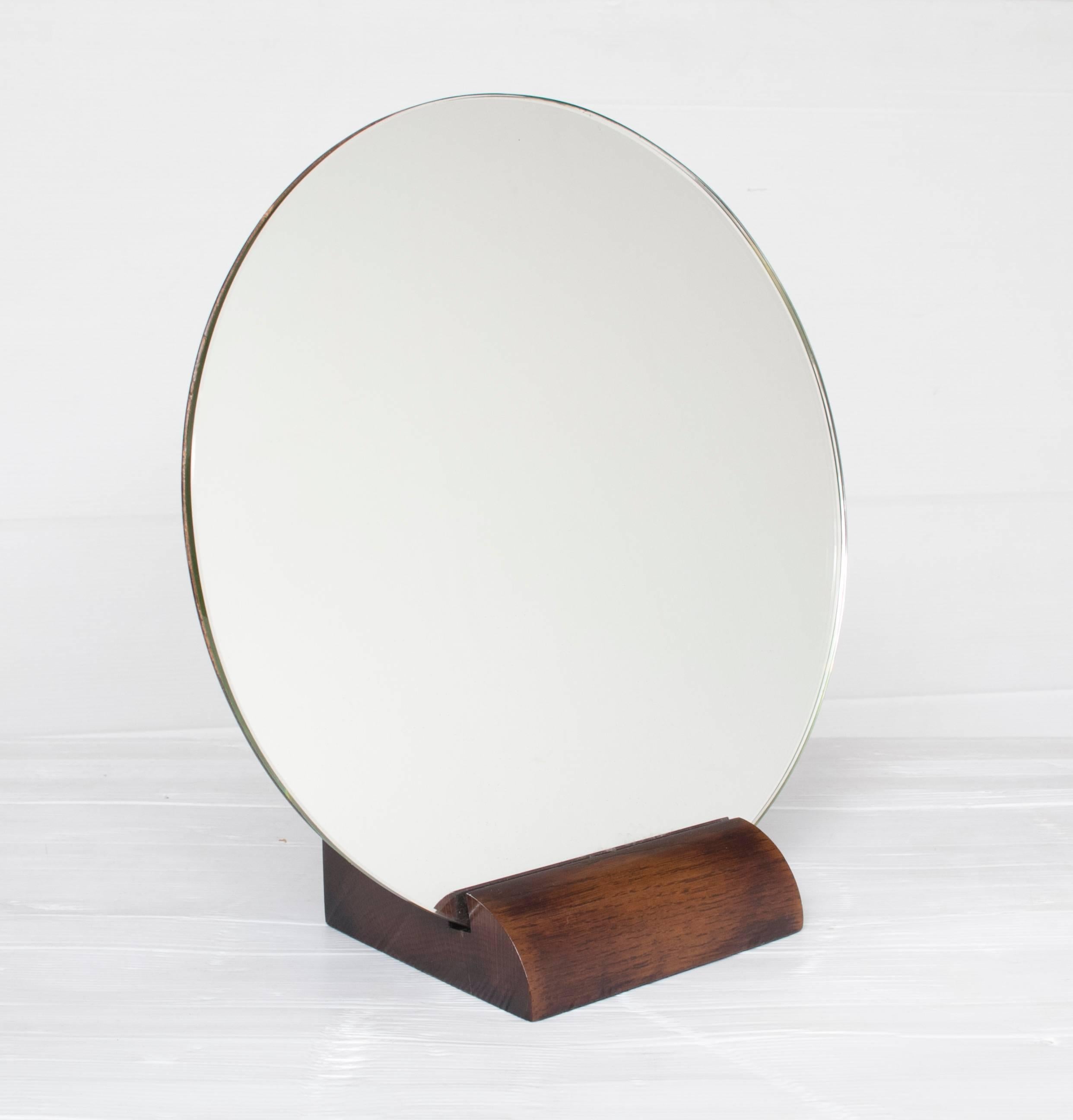 Art Deco French mirror.
The finest Art Deco mirror attributed to Emile-Jacques Rhulmann
Circular mirror set in solid walnut, walnut backed with a curve to the edge, giving the appearance of a floating mirror.
This early example dates from circa 1920