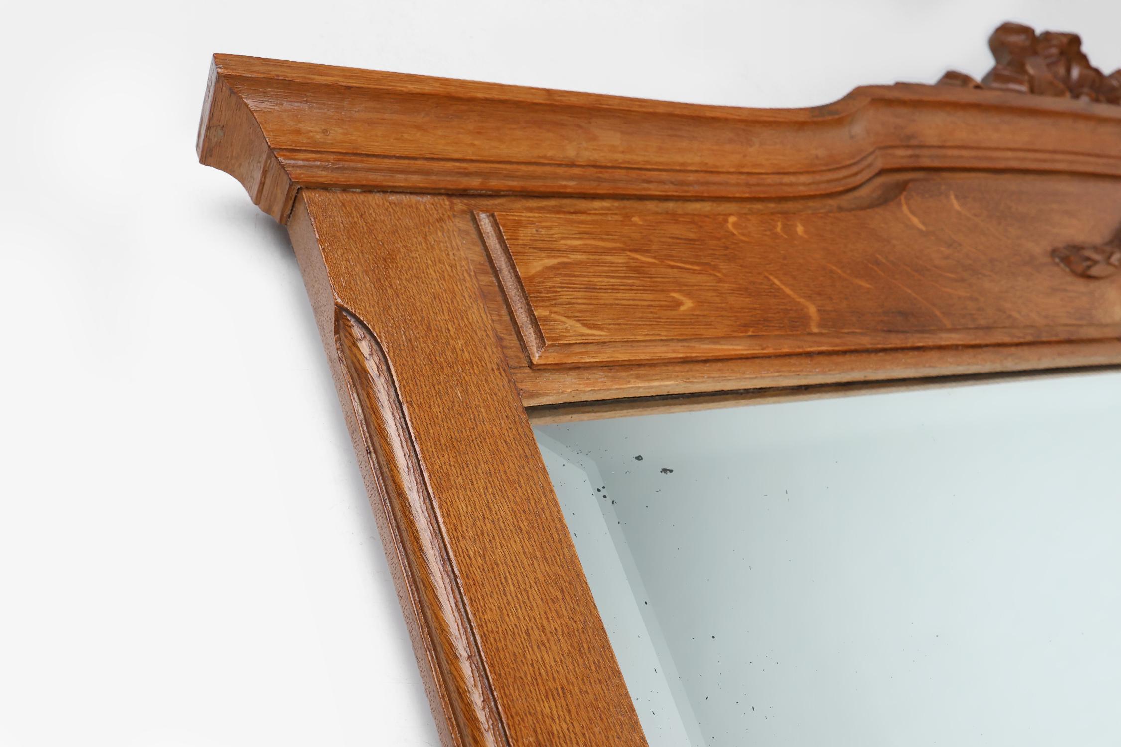 Hand-Carved Art Deco mirror in oak with carved decorations and facet cut mirror, 1930s For Sale