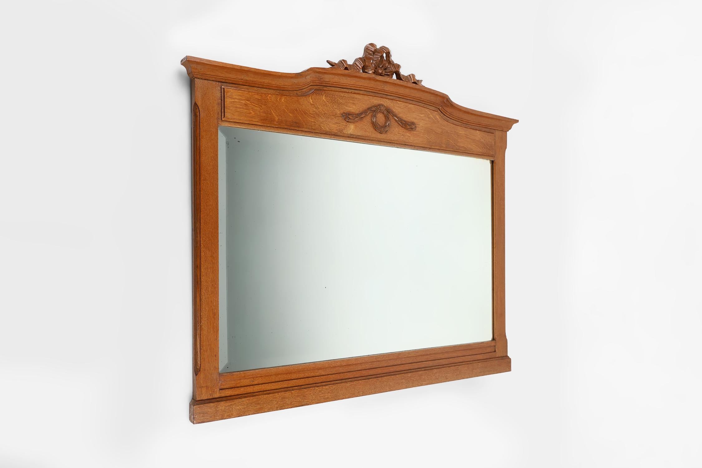 Mid-20th Century Art Deco mirror in oak with carved decorations and facet cut mirror, 1930s For Sale