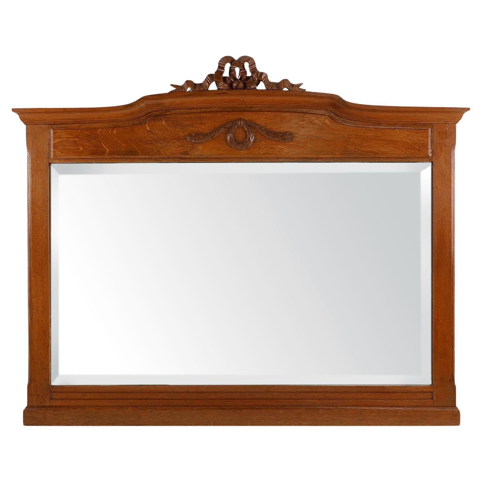 Specchio Deco Mirror in quercia con decorazioni intagliate e specchio sfaccettato, anni '30