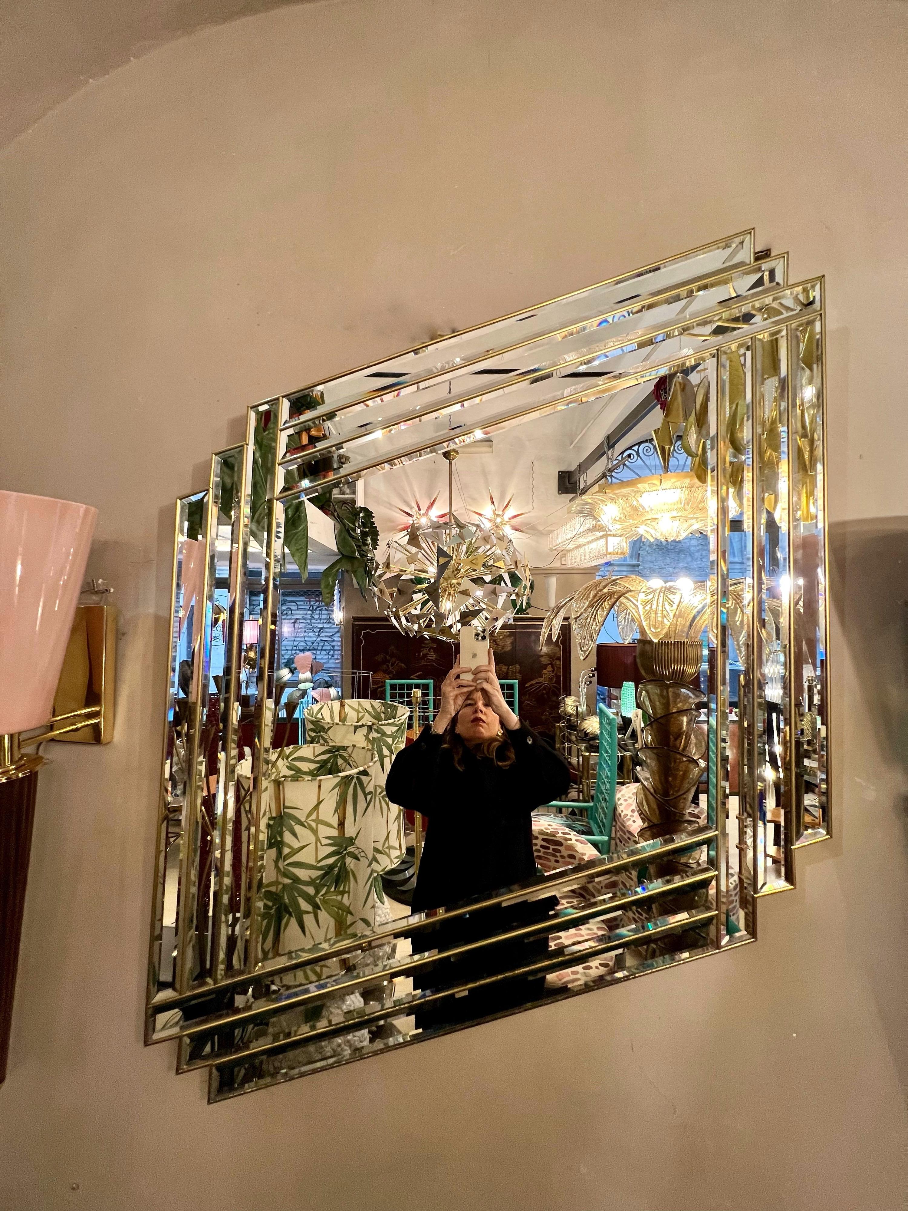 Art Deco mirror in the shape of a rhombus with brass inlays. It can be hooked horizontally, vertically or at an angle. Perfect vintage condition of the mirror.