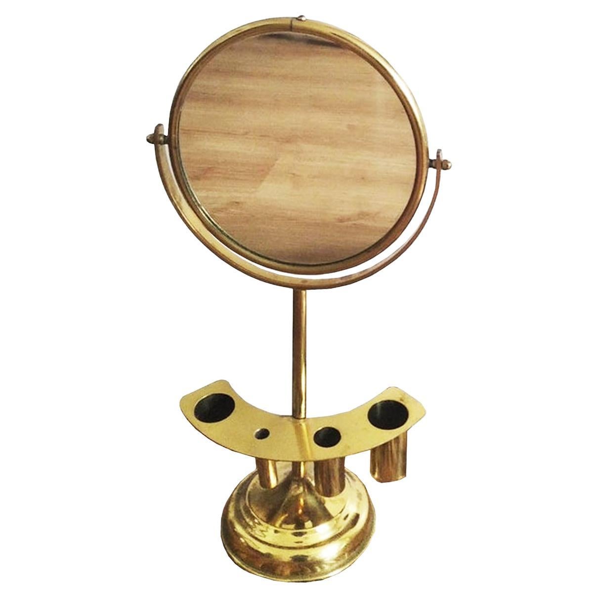 Brass dressing table mirror, mid-20th century.

Art Deco style

Brass dressing mirror

Elegant tilting brass table top mirror.

 