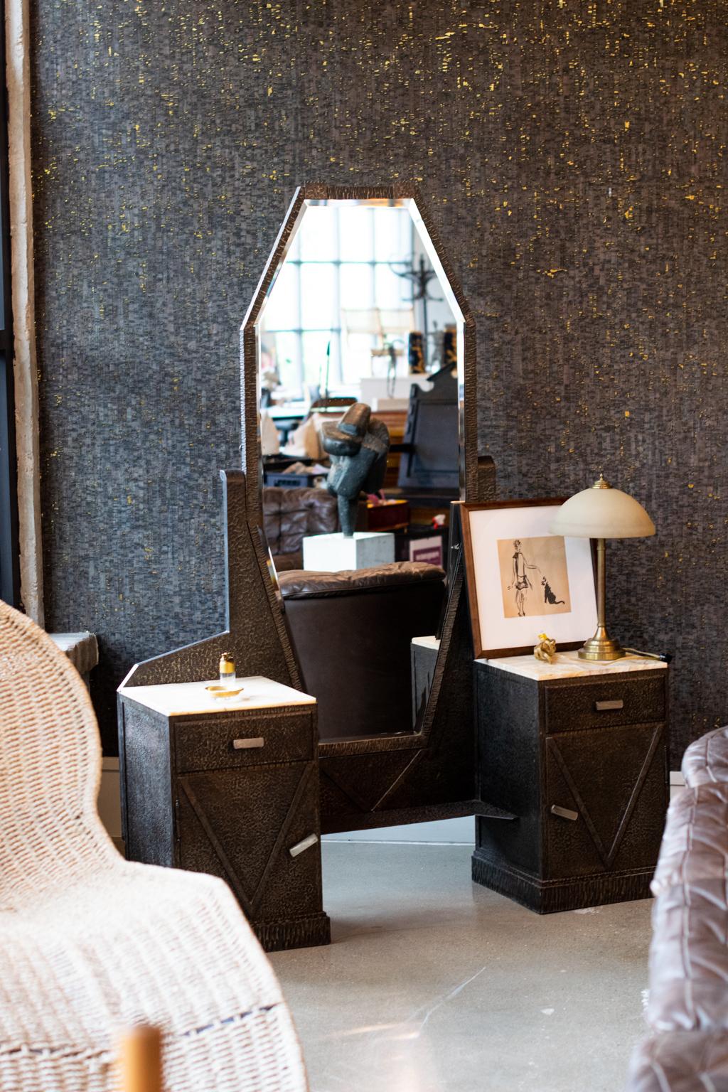 Art Deco dressing table with full length beveled mirror. Cabinets and frame are formed from steel that looks like bronze with onyx cabinet tops and original mirror. The hammered and finished steel is strongly reminiscent of work by Pier Luigi Colli