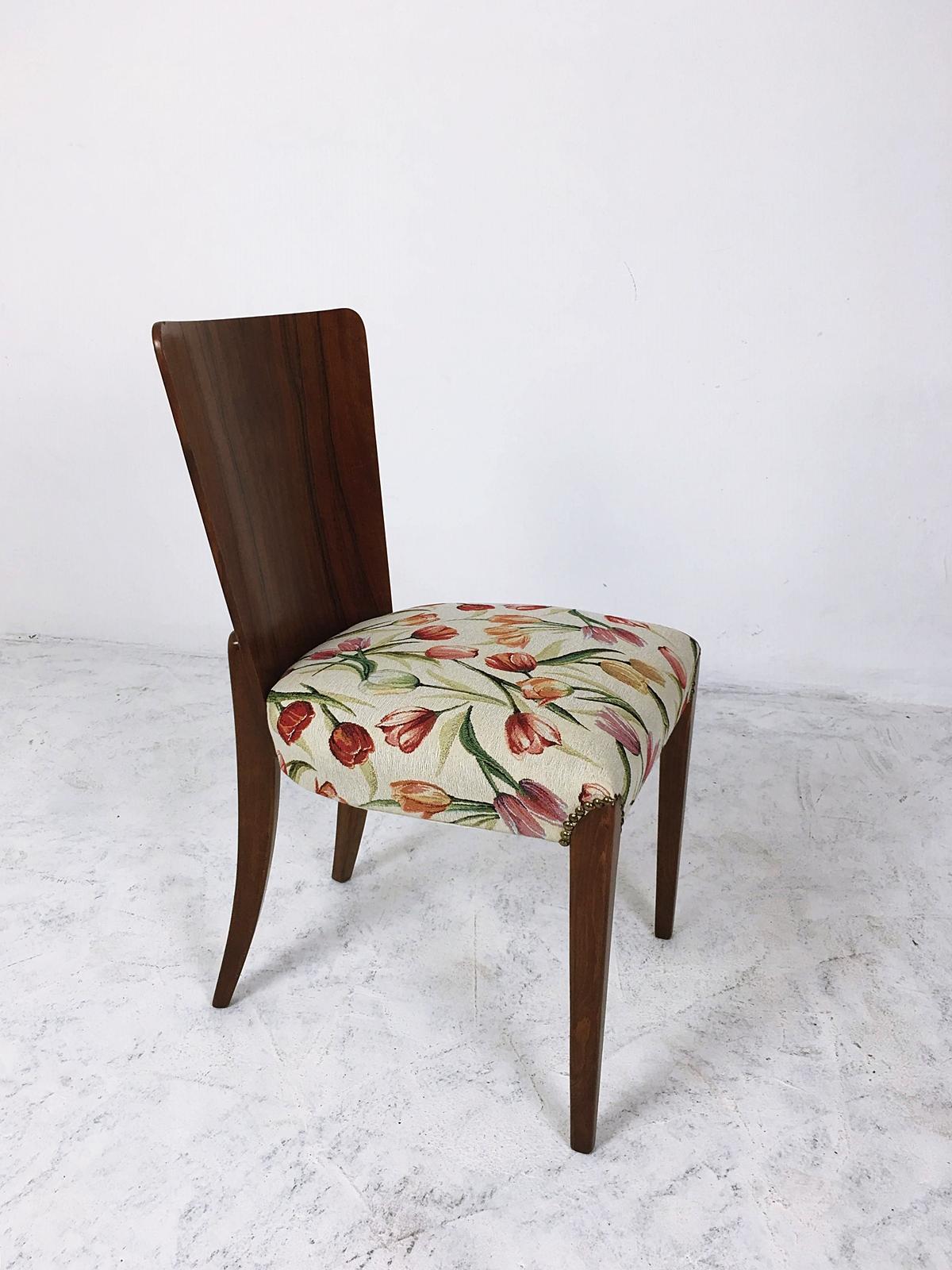 These Art Deco chairs, model H - 214, were designed by Jindrich Halabala and manufactured by Up Zavody in Czechoslovakia. The set features a beech frame with newly upholstered seats. The wood has been refreshed and the shape has been kept in every