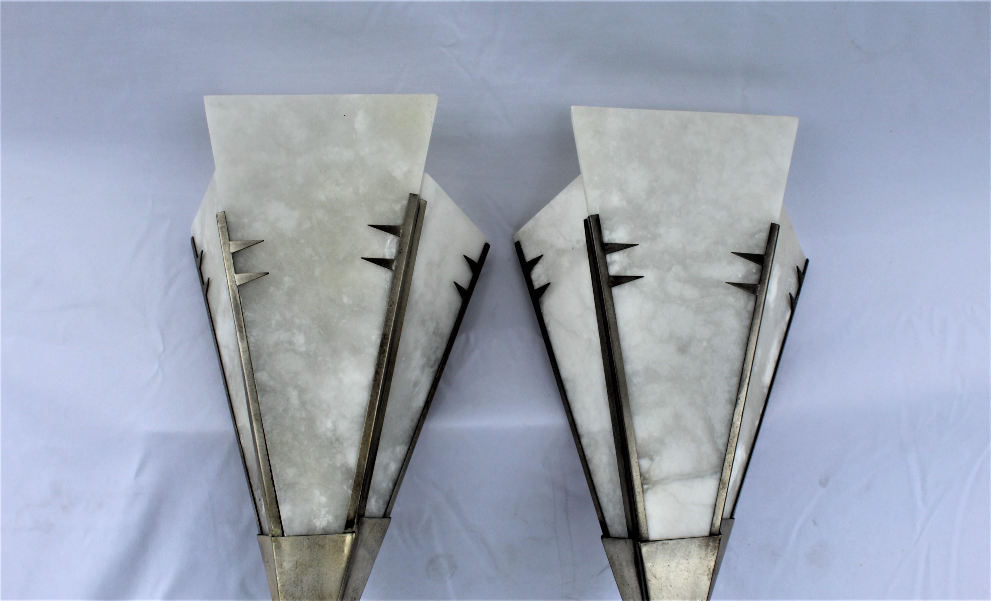Large fan shape Alabaster sconces. Custom made with lost wax bronze frame and brass back plates. Finished in Hi Polished Nickel finish. Designed by Andre Dominic! Single candelabra. Light up very nice. 25