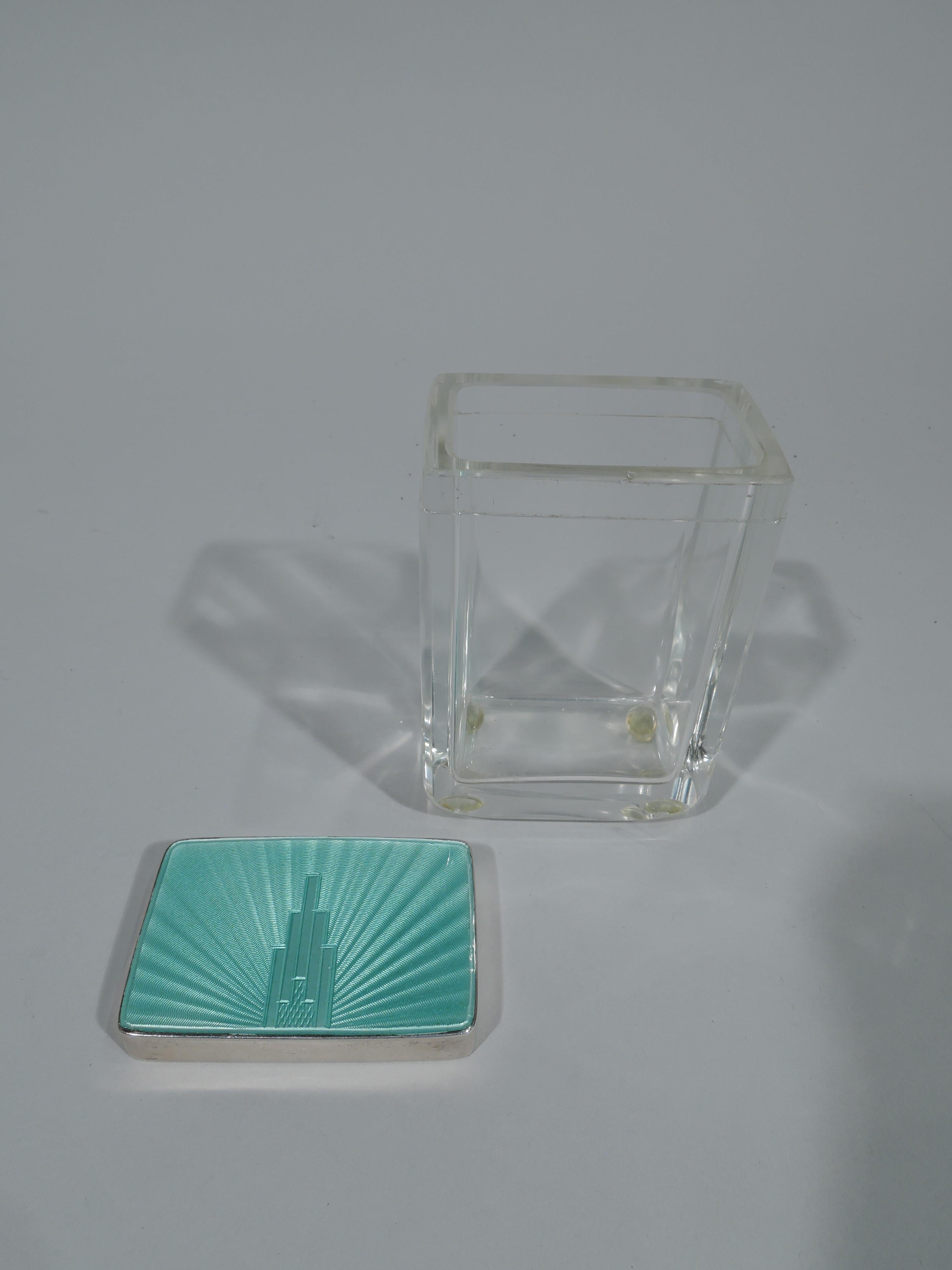 George V clear glass jar with sterling silver and enamel cover. Made by Henry Clifford Davis in Birmingham in 1933. Box is rectangular. Cover has green guilloche enamel top with skyscraper radiating shaded lines. The cover sides are silver. Smart
