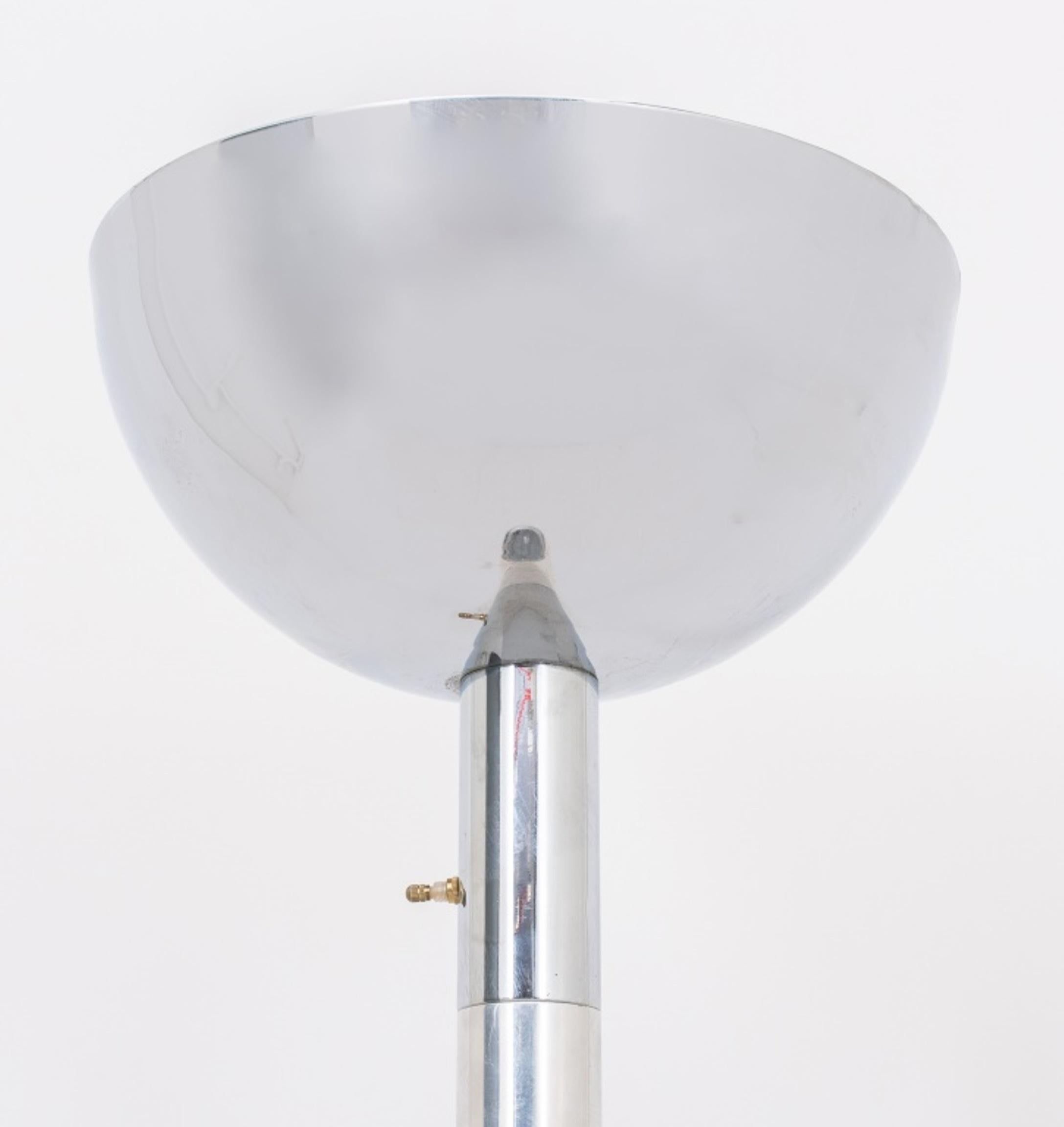 Art Deco Moderne chrome torchiere or floor lamp with bowl shaped shade surmounting a tapering columnar shaft on round base. In very good vintage condition.

Dealer: S138XX