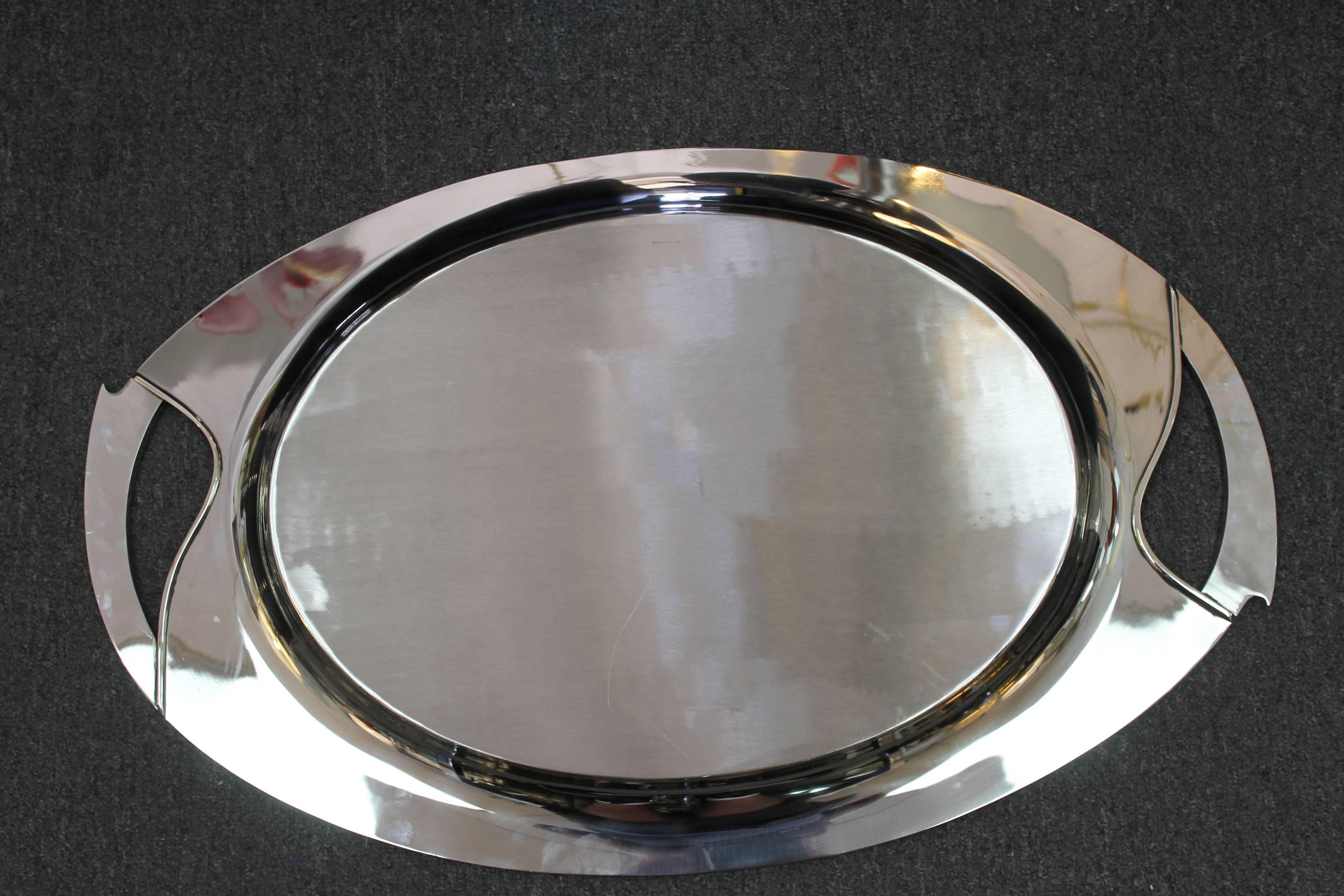 Monumental and heavy solid nickel silver tray with exquisite curvilinear design. Highest quality hand construction. Stamped Nickel Silver on the back. We believe this tray to be from the 1930's. We had it professionally polished. Tray measures 29.5”