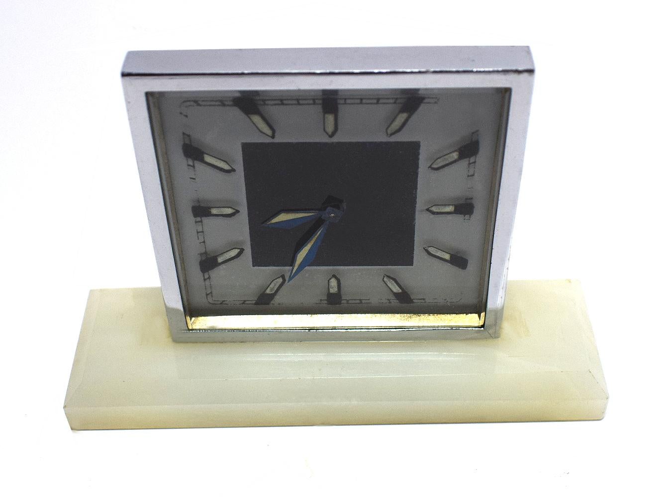 For your consideration is this wonderfully stylish modernist clock. Dating to the 1930s Art Deco period this clock is made from chrome and on an Oynx base with phosphorescent hands and dial. Recently serviced by our horologist this clocks well and