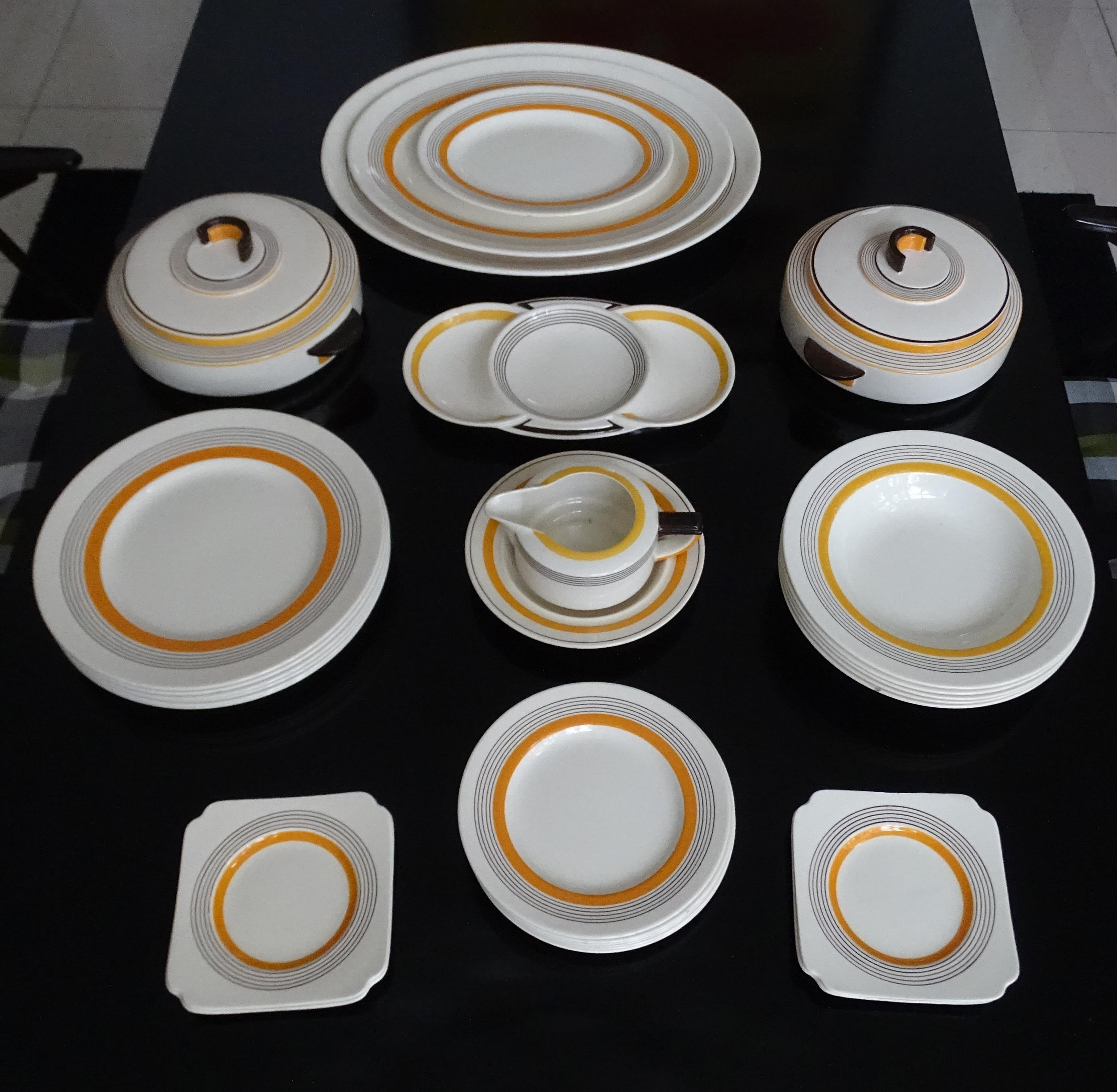 Extremely rare Art Deco dinner set manufactured by Royal Doulton during the 1930s.
The design is called Marquis, an original Art Deco style set from the 1930's which was also dubbed the casino style. It is predominantly white with five concentric