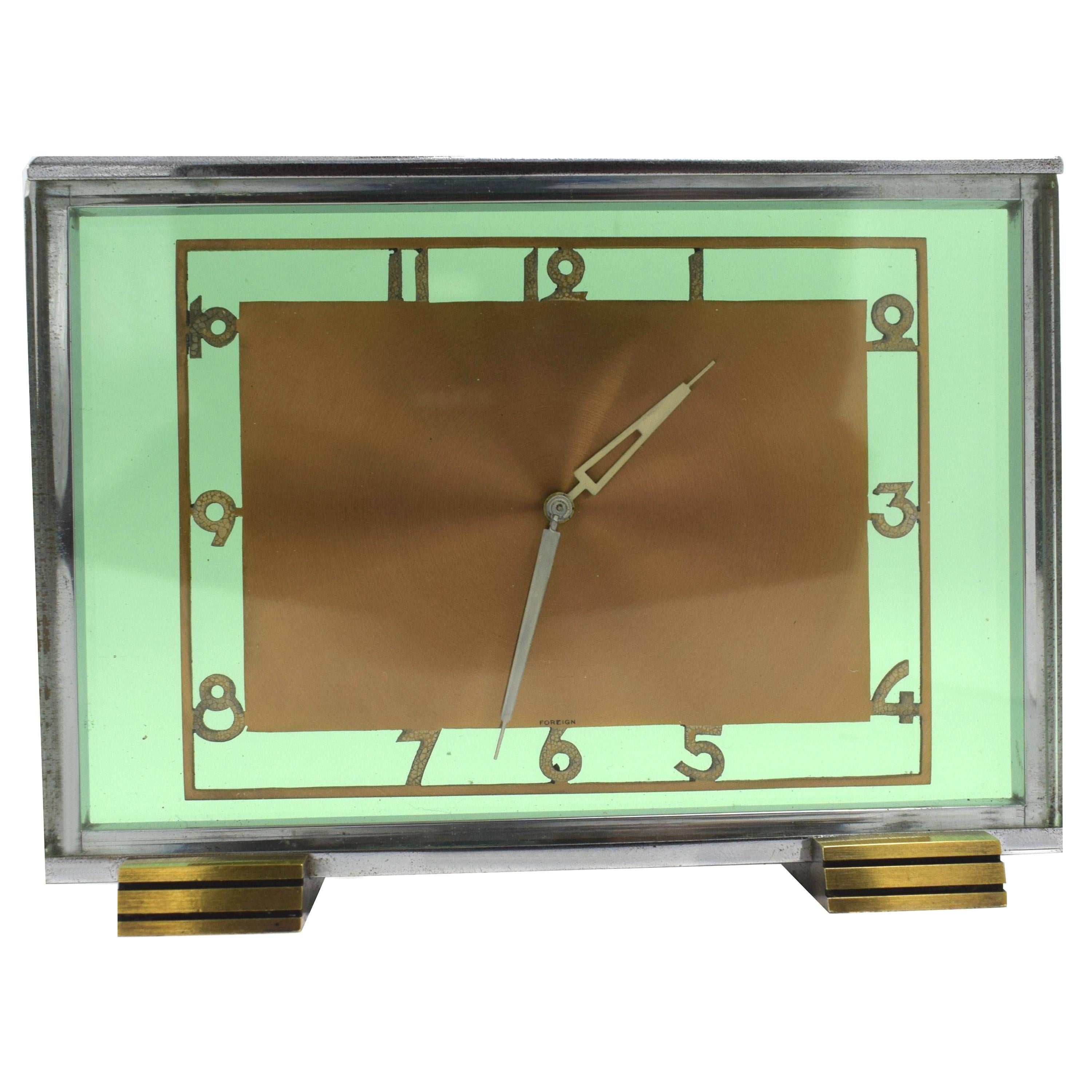 Very stylish 1930s Art Deco modernist pale green glass clock within a chrome frame. On picking this clock up one can't ignore the weight which feels unusually heavy, the quality is undeniable. The two thick panes of green glass sit either side a
