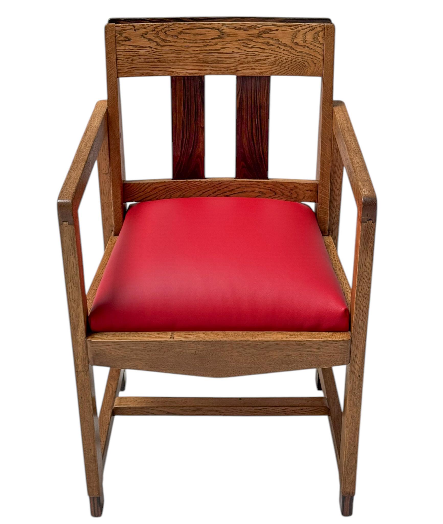 Magnificent and rare Art Deco Modernist armchair.Solid oak frame with decorative macassar elements.The seat has been re-upholstered with red high quality leather.This wonderful Art Deco Modernist armchair is in very good original condition with