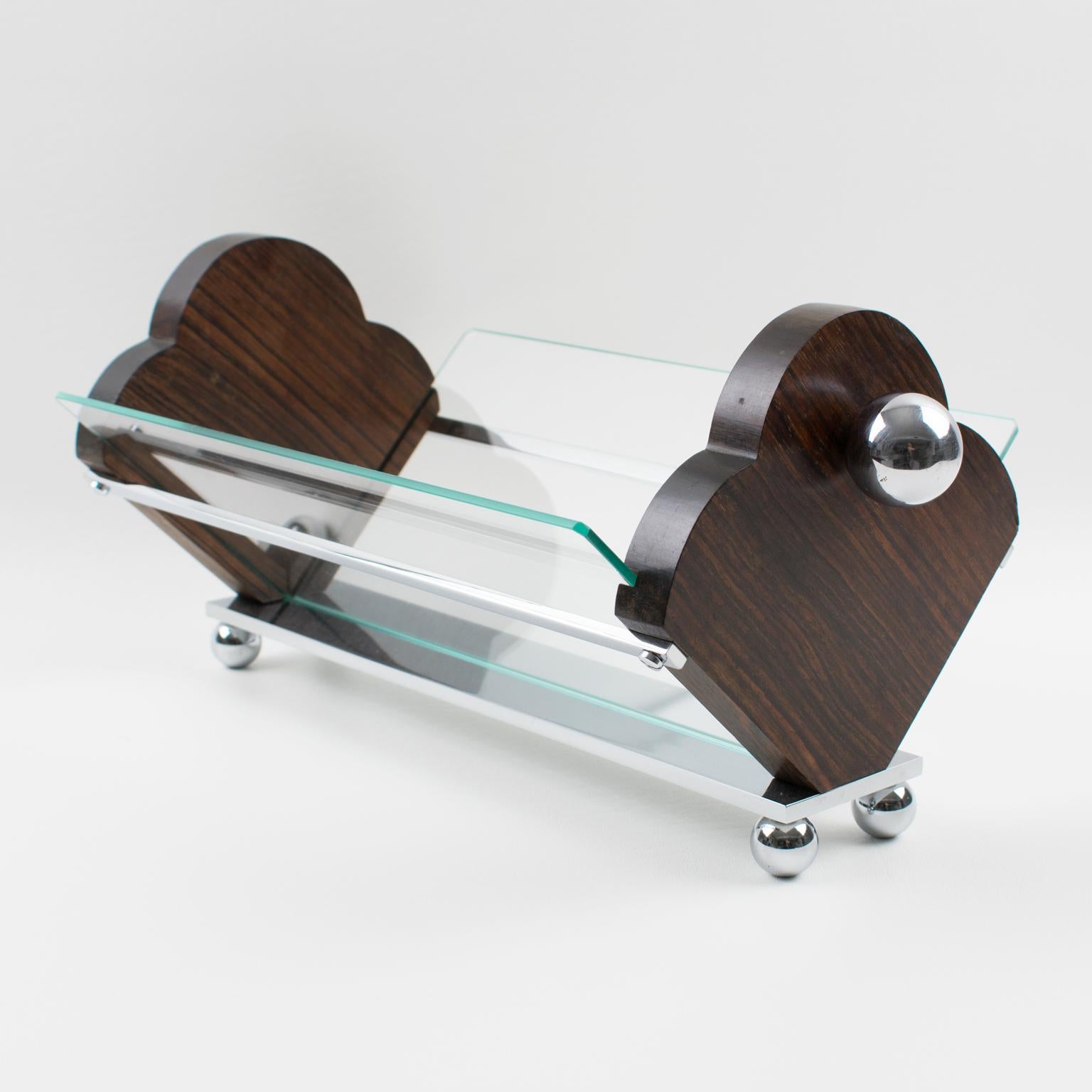 This stunning Art Deco centerpiece, serving bowl, or fruit or bread basket was manufactured in France circa 1930. The Macassar wood sides have two large chromed metal ball handles. A chromed metal structure holds a shaped glass panel on each side.