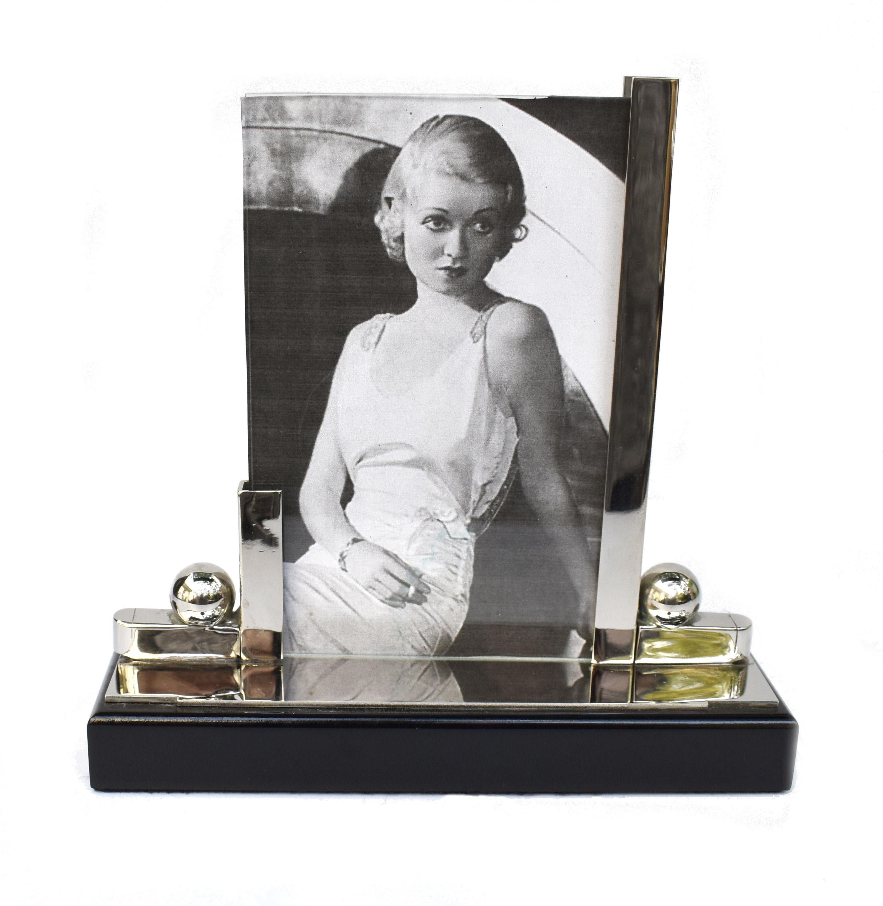 Superbly stylish 1930's Art Deco chrome & ebonised picture frame. A more unusual design and a great size for modern day use. A photograph can be displayed both sides ( the photo in the frame is for display purposes only and not original). Condition