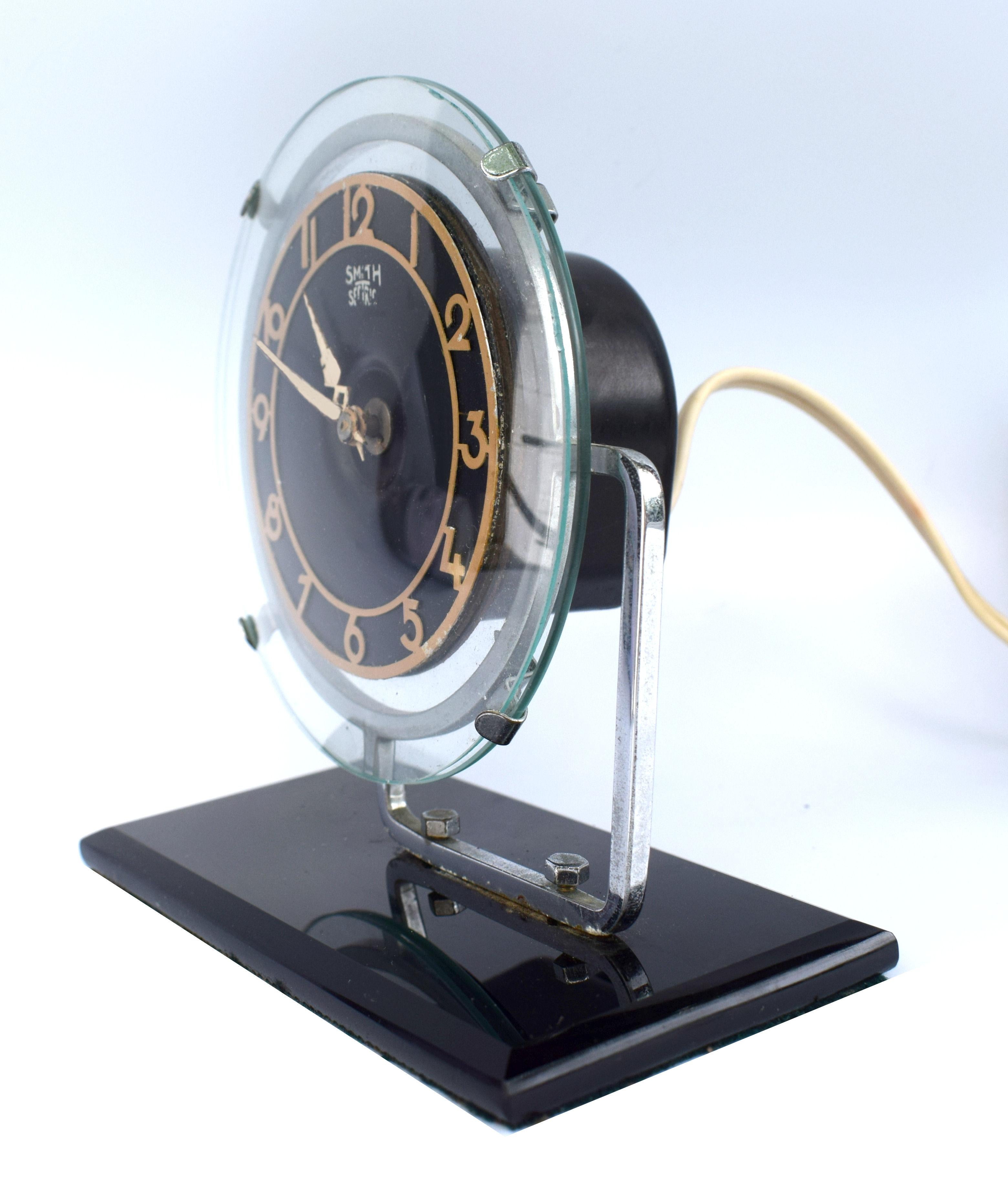 Quite a rare model, modernist 1930s Art Deco clock by English makers Smiths GEC, runs on electric, so plug in and go! Black vitrolite (compressed glass) with chrome bezel and black enameled fretted out numerals. The movement is encased in a Bakelite
