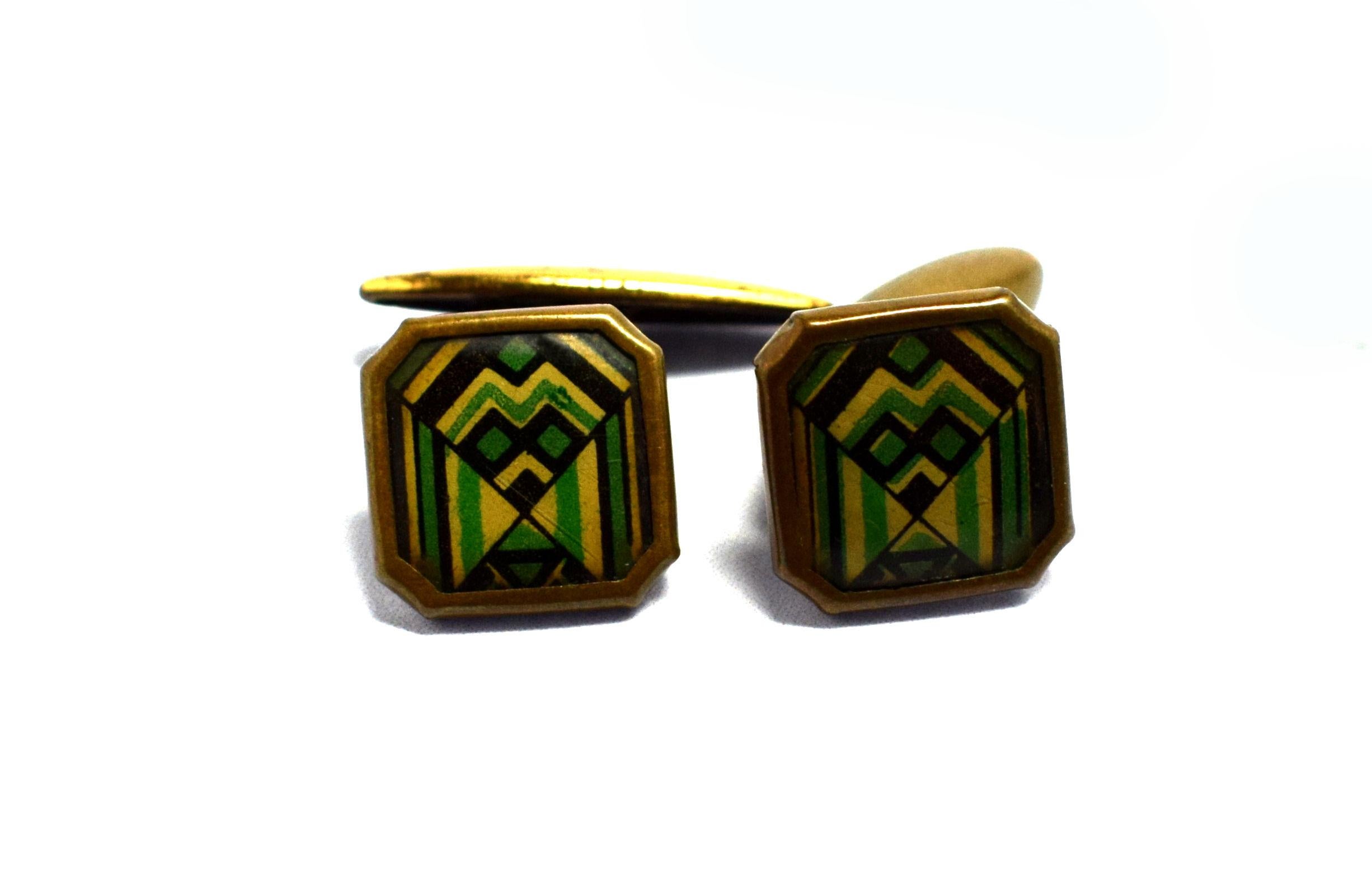 Extremely stylish and totally original are these matching pair of English 1930s Art Deco modernist enamel gents cufflinks. Fabulous geometric patterning and color, with a slight modernist feel. Condition is very good with only signs of age to the