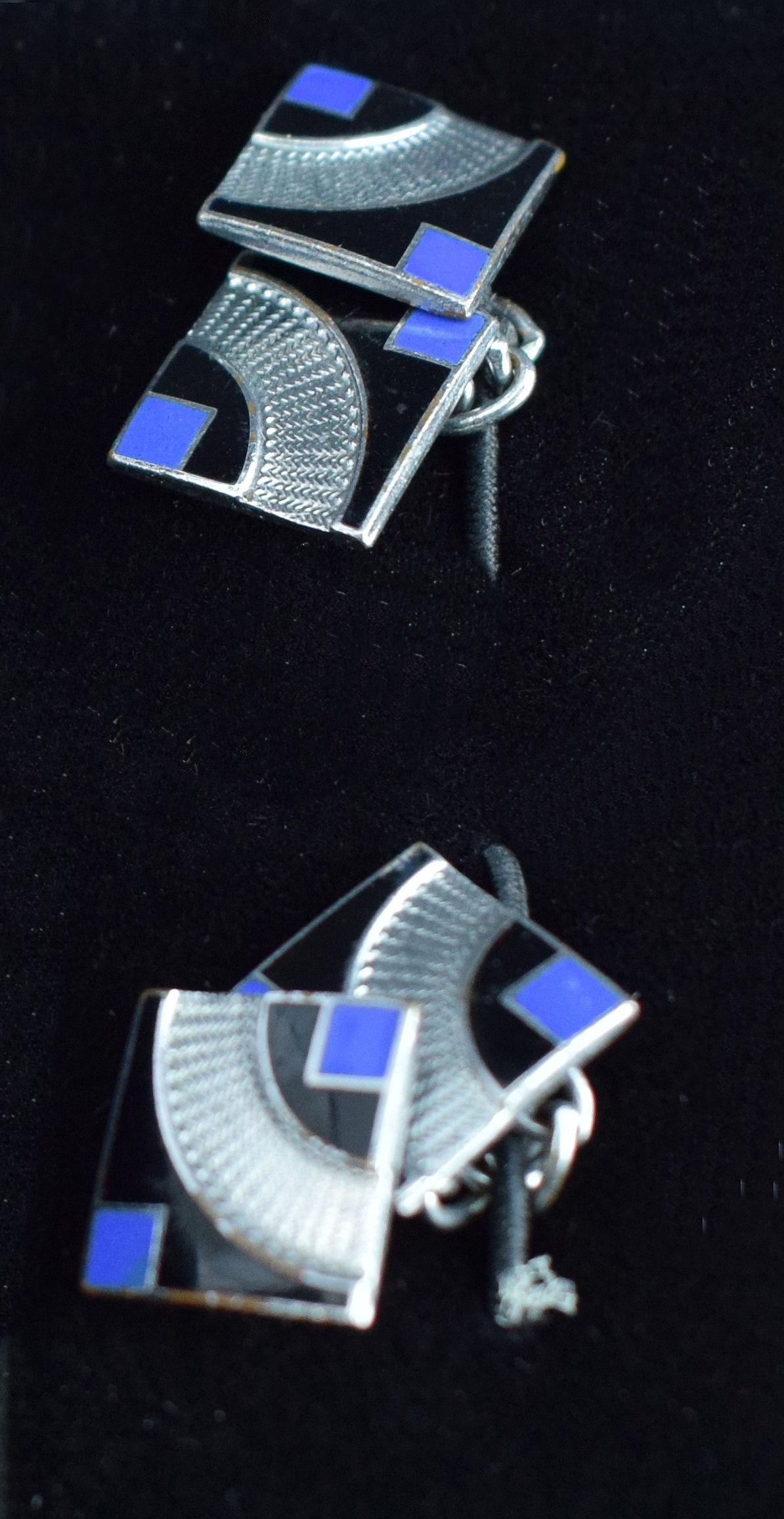 Extremely stylish and quite rare are these matching pair of English 1930's Art Deco modernist enamel gents cufflinks. Fabulous geometric patterning and colour. Vivid blue, silver and jet black enamelling make the perfect and striking combination.