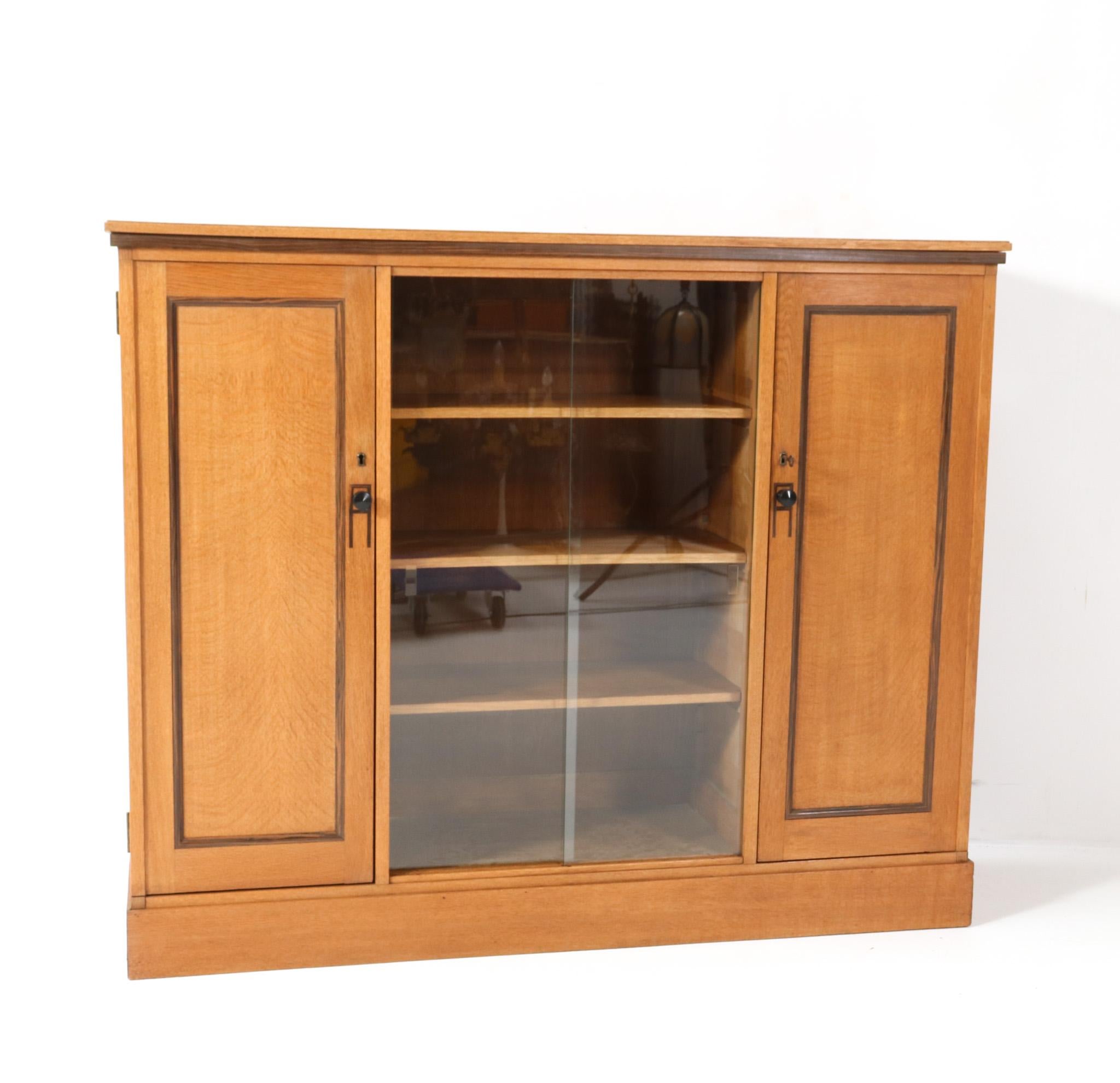 Early 20th Century Art Deco Modernist Oak Bookcase with Glass Sliding Doors, 1920s For Sale