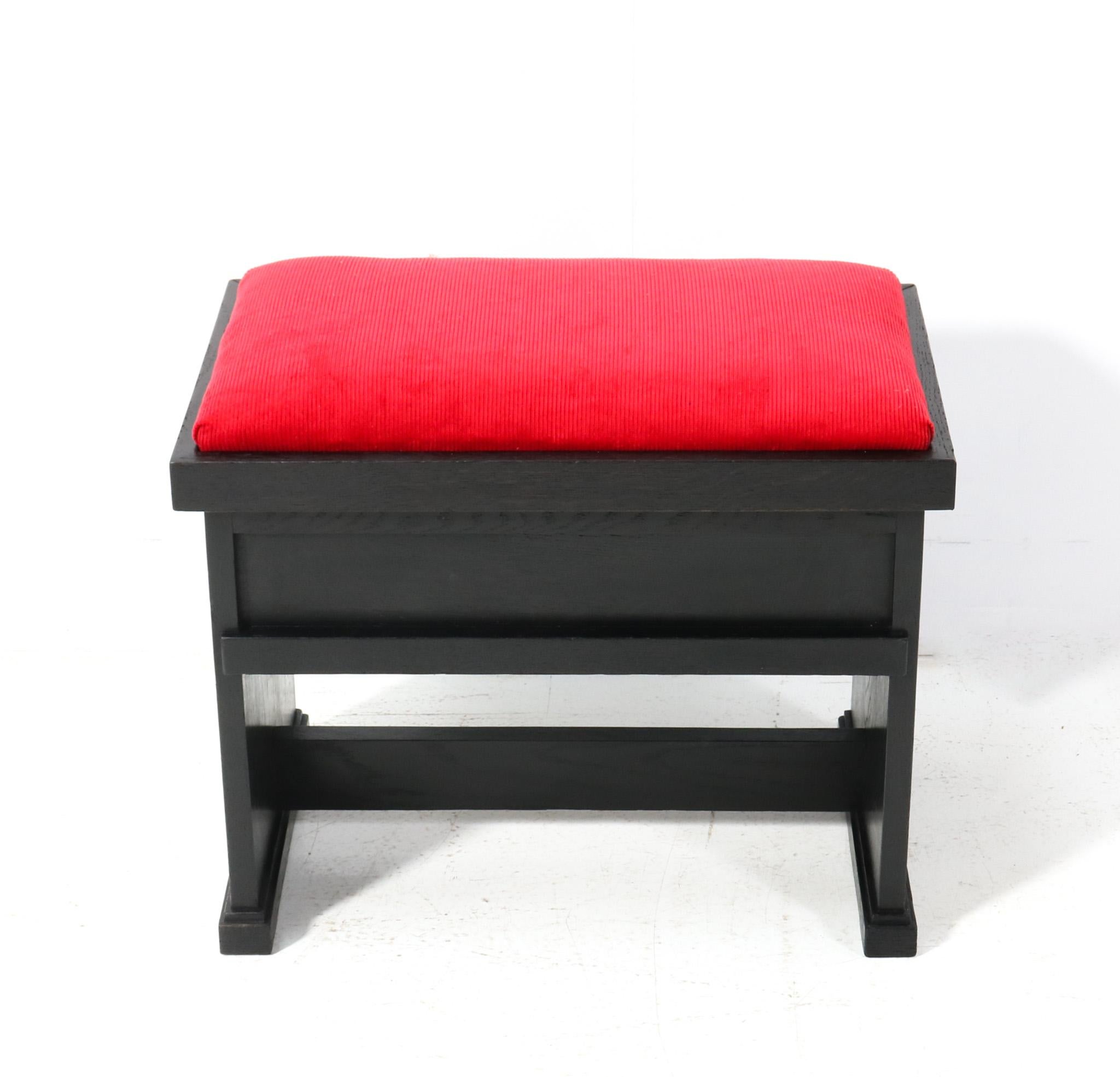 Magnificent and ultra rare Art Deco Modernist stool.
Design by Hendrik Wouda for H. Pander & Zonen Den Haag.
Striking Dutch design from the 1920s.
Original black lacquered oak frame with re-upholstered seat in red Manchester corduroy fabric.
You can