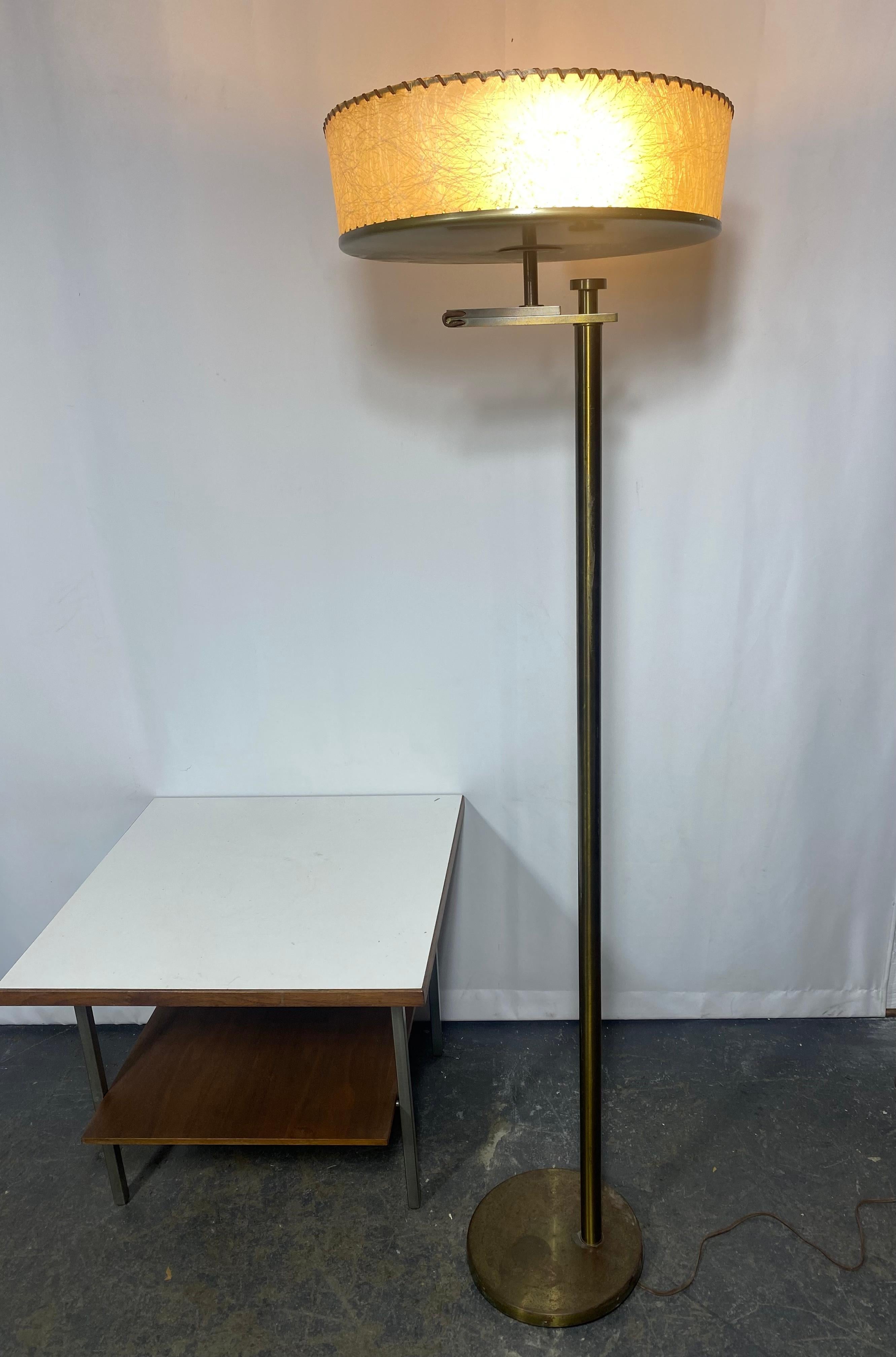 Simple and elegant Flip floor lamp by Kurt Versen. Spectacular design from 1935 where the lamp doubles as a reading lamp and a torchiere. Just flip the shade upward or downward and it looks amazing in either position.Retains original (often