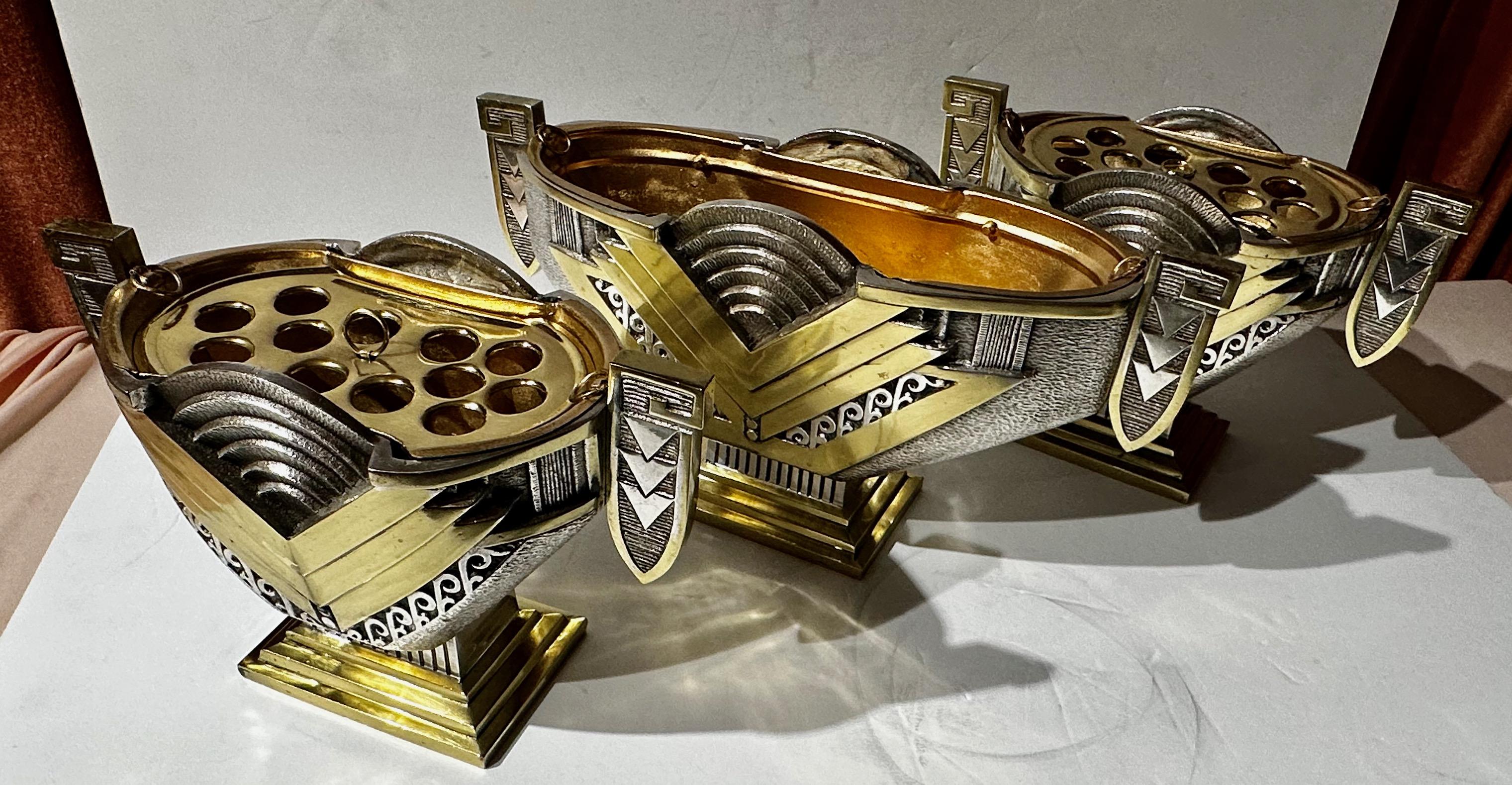 Art Deco Modernist Silver and Brass Jardiniere Three Piece Set This set represent exceptional examples of the decorative arts during the Art Deco era. Using bronze, silver plating, and gilded ornamentation all contribute to its luxurious and stylish