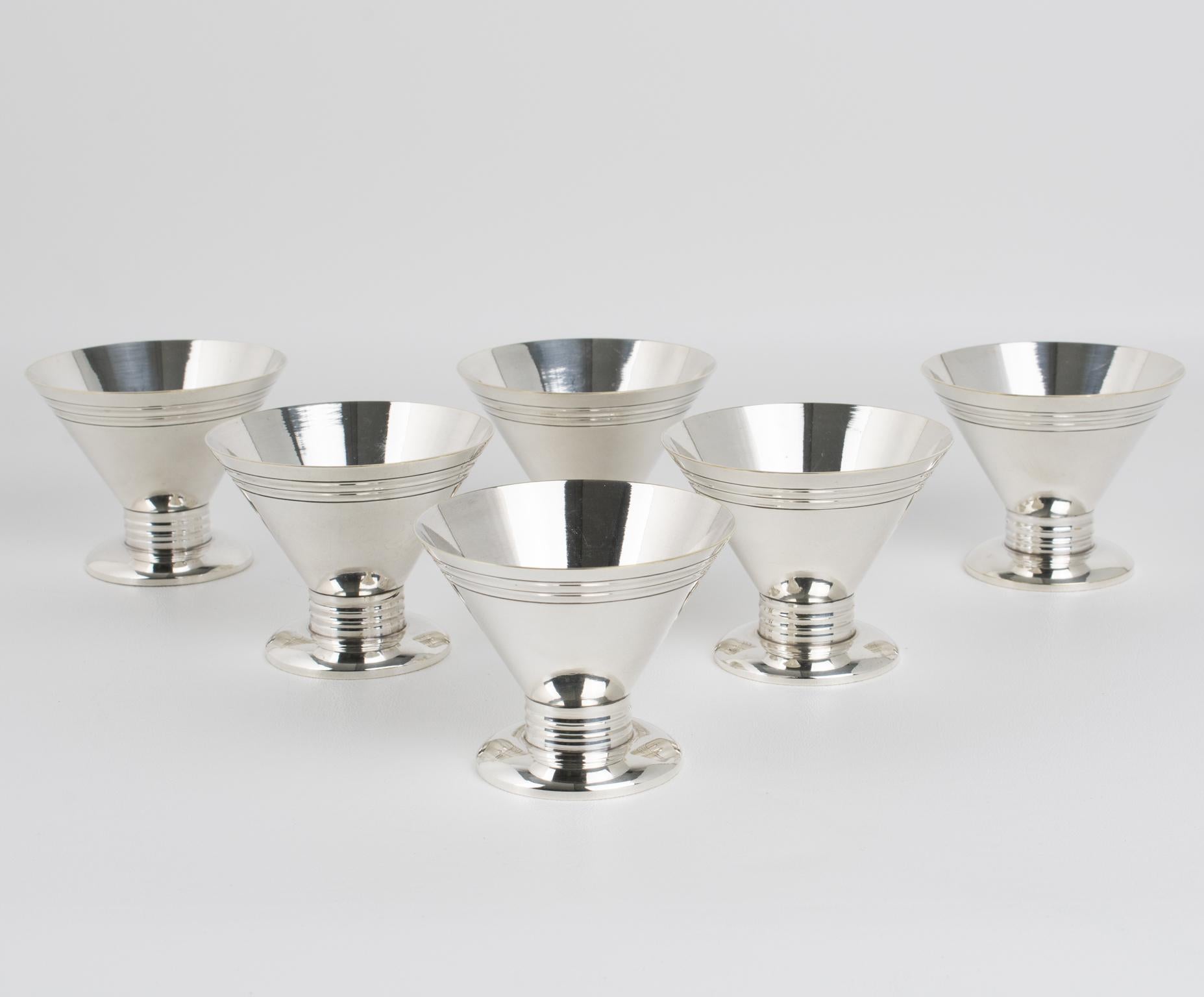 This elegant Art Deco silver plate barware serving set was crafted in France in the 1940s. The bar set consists of six silver plate cocktail cordial cups or shot glasses with a stunning streamlined geometric design. There is no visible maker's