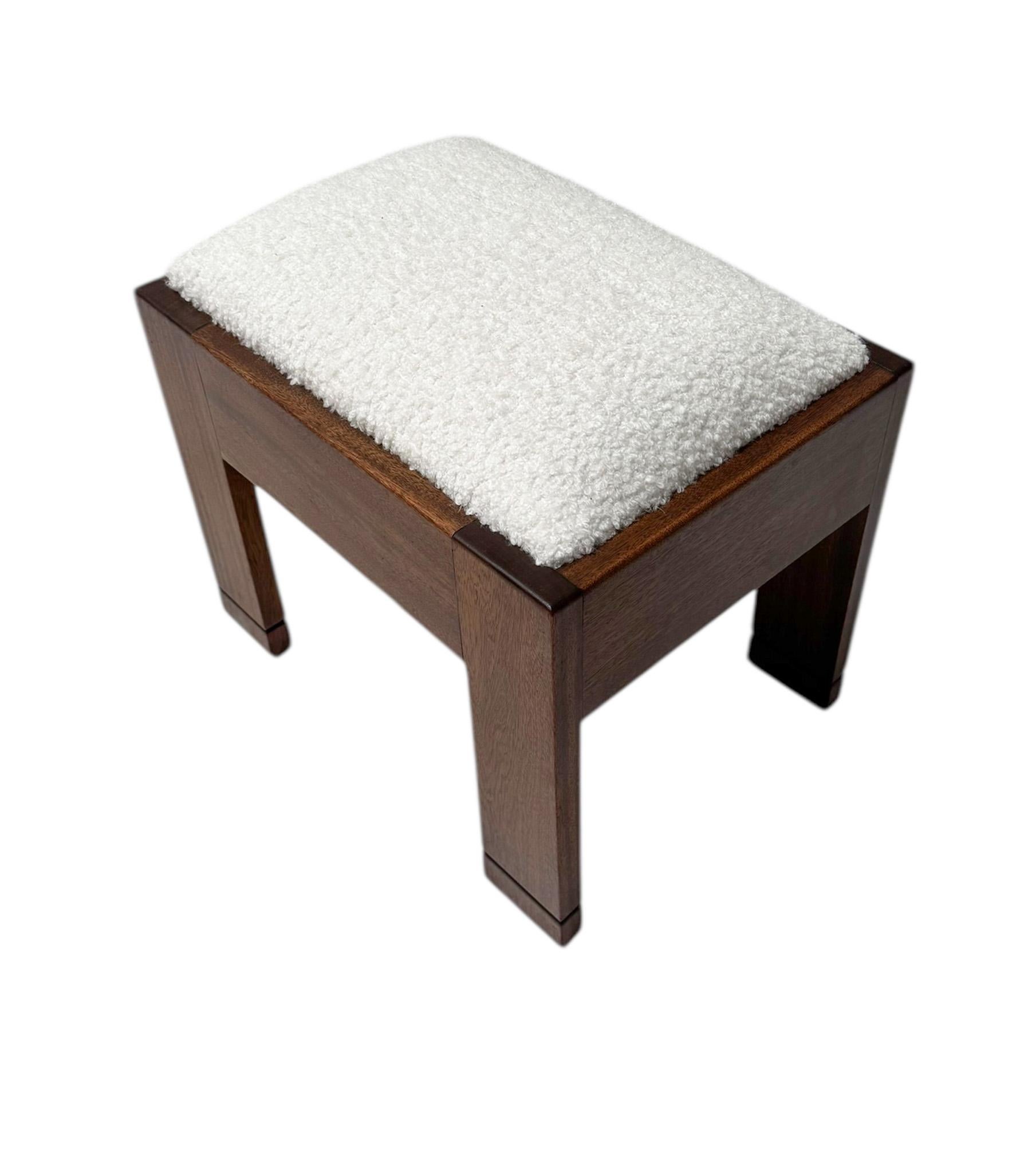 Magnificent and rare Art Deco Modernist stool.
Design by J.A. Muntendam for L.O.V. Oosterbeek.
Striking Dutch design from the 1920s.
Solid walnut base with re-upholstered seat in off-white bouclé.
Marked with original manufacturers tag.
This