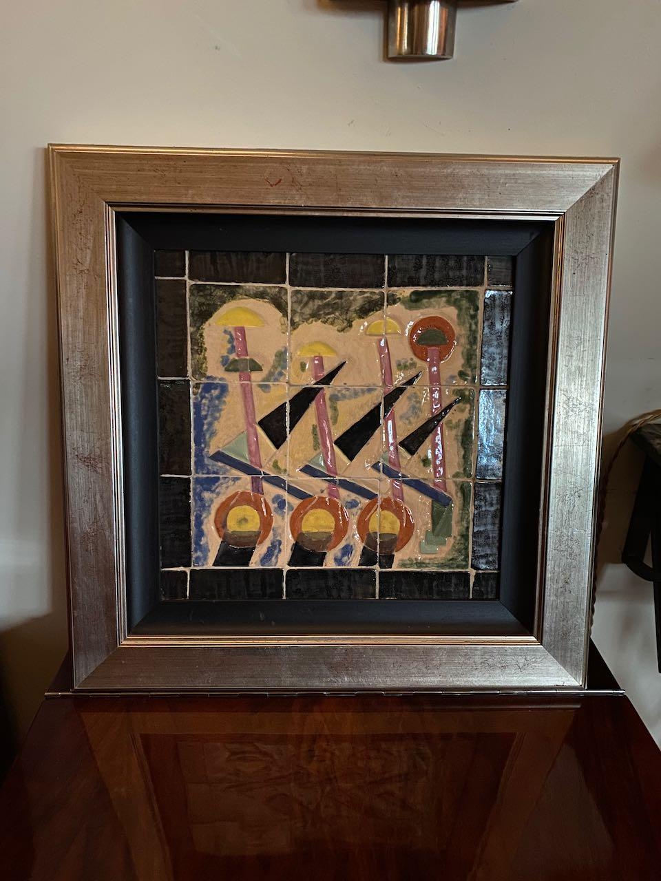 Art Deco modernist tile painting. Hand painted enamel tiles with a canvas painterly quality. The design is somewhat cubist symmetrical and very dynamic. Super quality, colors of black, gray, pink topaz, yellow and orange.

This is a one of kind