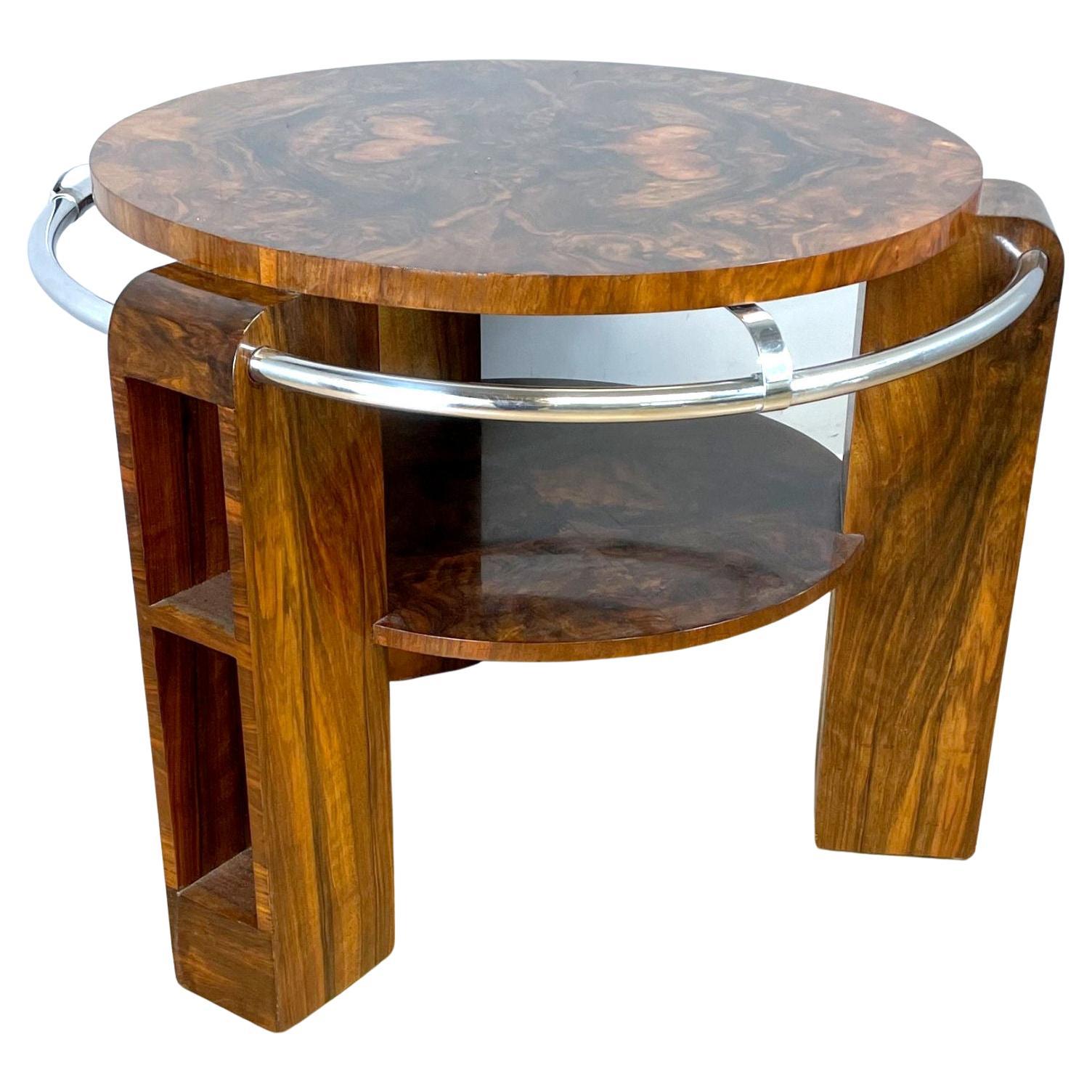 For your consideration is this rare opportunity to acquire a highly stylised Art Deco circular occasional table dating to the 1930's and believed to be English in origin. A chrome outer rail encircles the table and is in unusually good condition