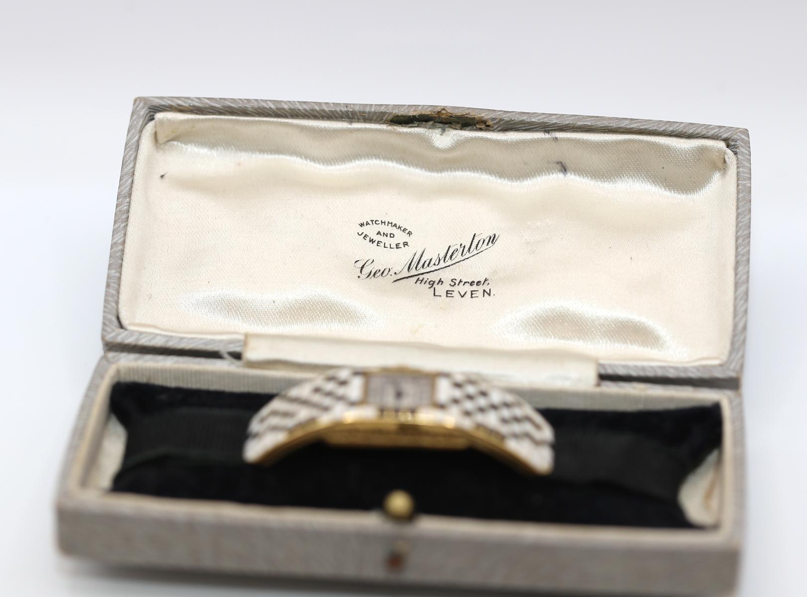 Art Deco unique enamel сheckered design lady's wristwatch. Presented in a period-correct box that has a special insert to hold it upright. The craftsmanship is of the highest level, even the sides are engraved. Both the case and the movement signed