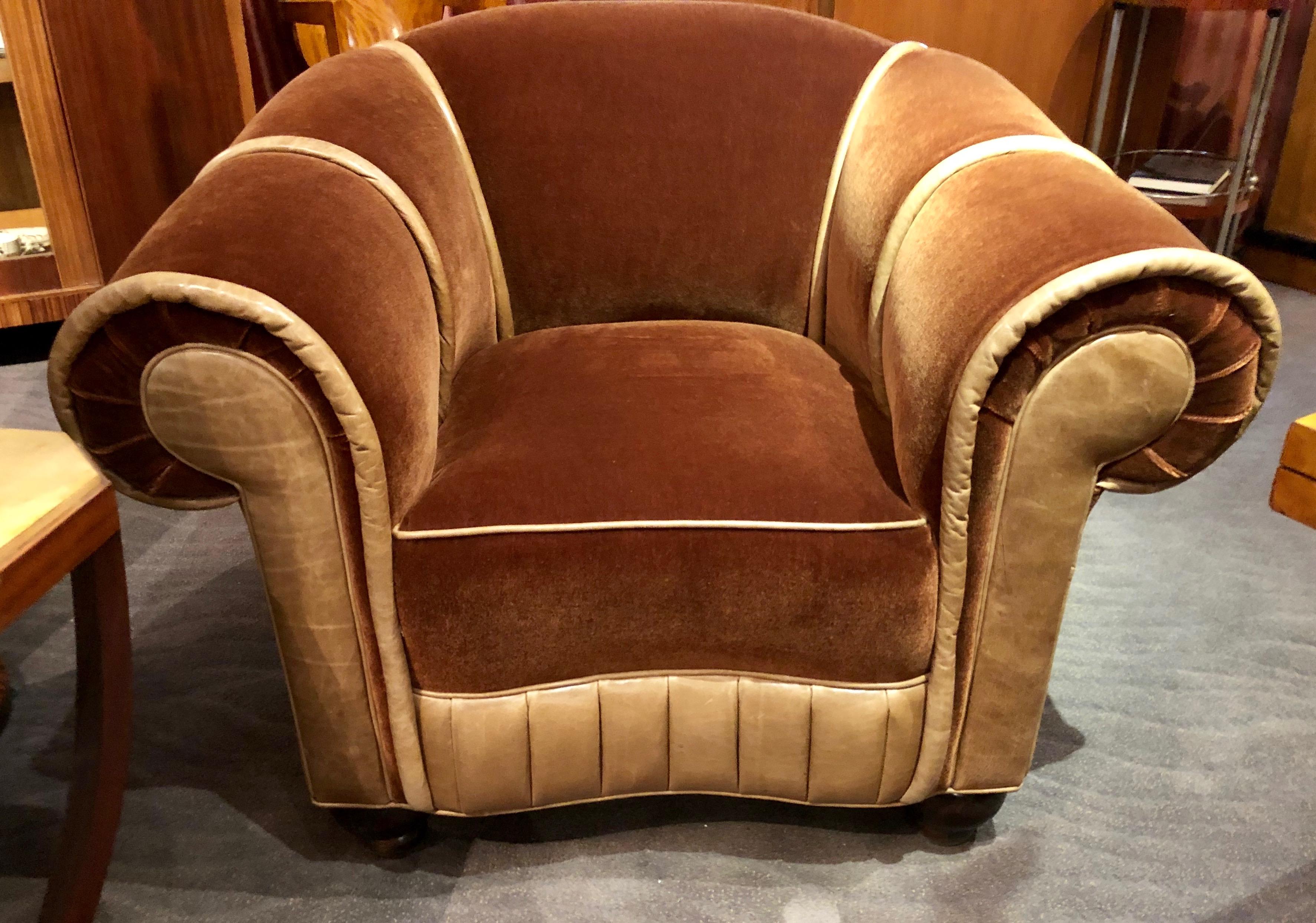 Art Deco glamour club chair. The is one off, restored with the finest materials of high quality rich root beer colored mohair and special leather. The design, inspired from an original Art Deco furniture catalogue. The oversized leather piping, with