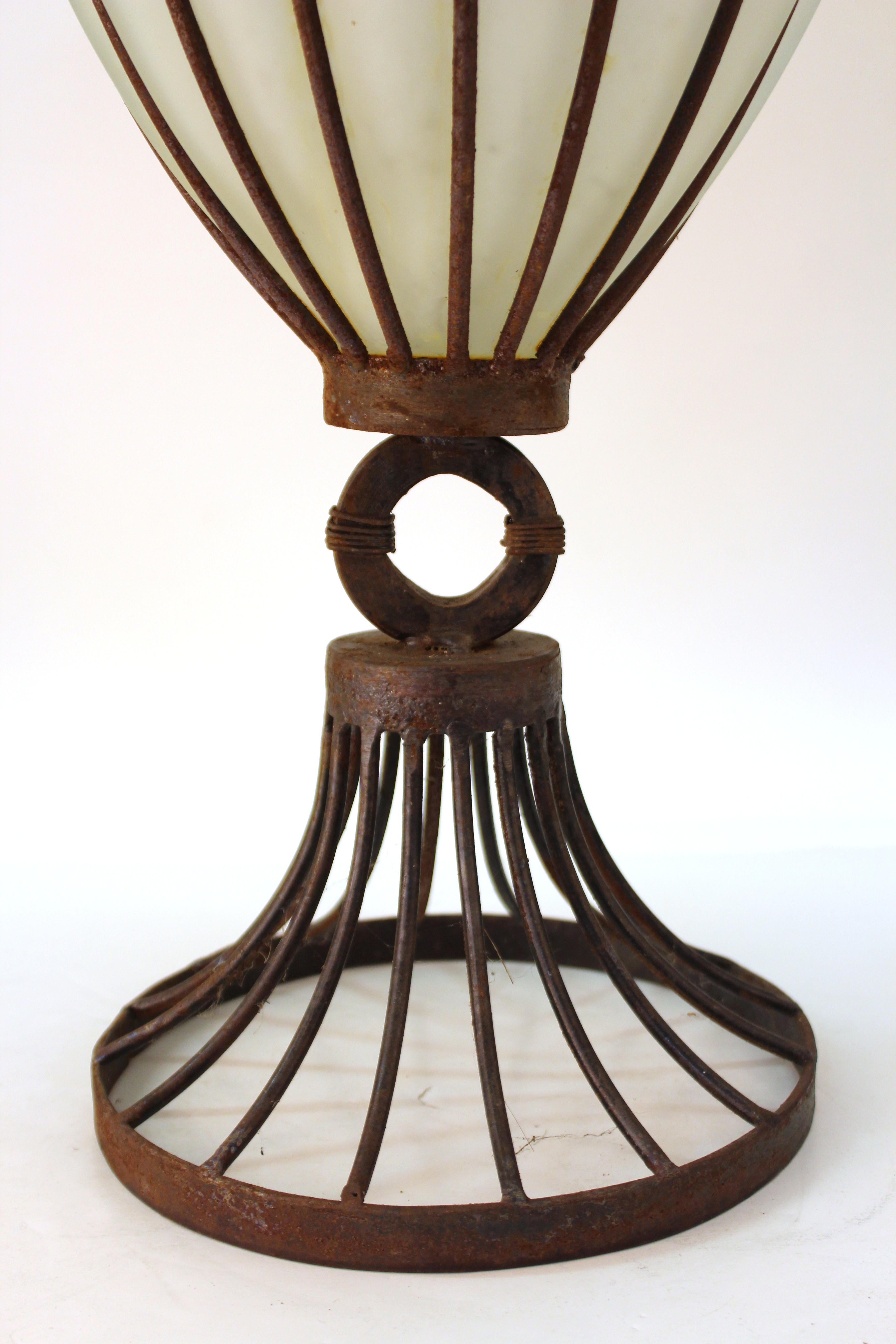 American Art Deco period monumental iron framed glass vase. The piece has age-appropriate rust on the metal surfaces and is in great vintage condition.