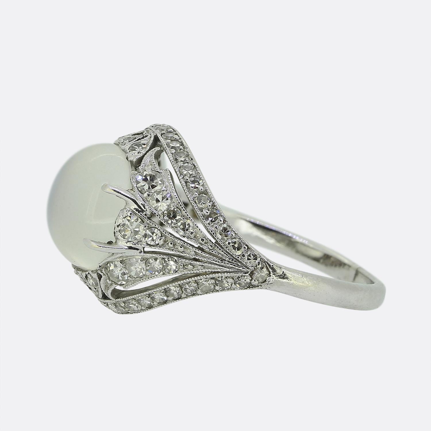 Here we have a wonderful ring dating back to the early 20th century. The ring is crafted in platinum and features an elegant free-flowing diamond set design. In the centre sits an enchanting cabochon moonstone.

Condition: Used (Very