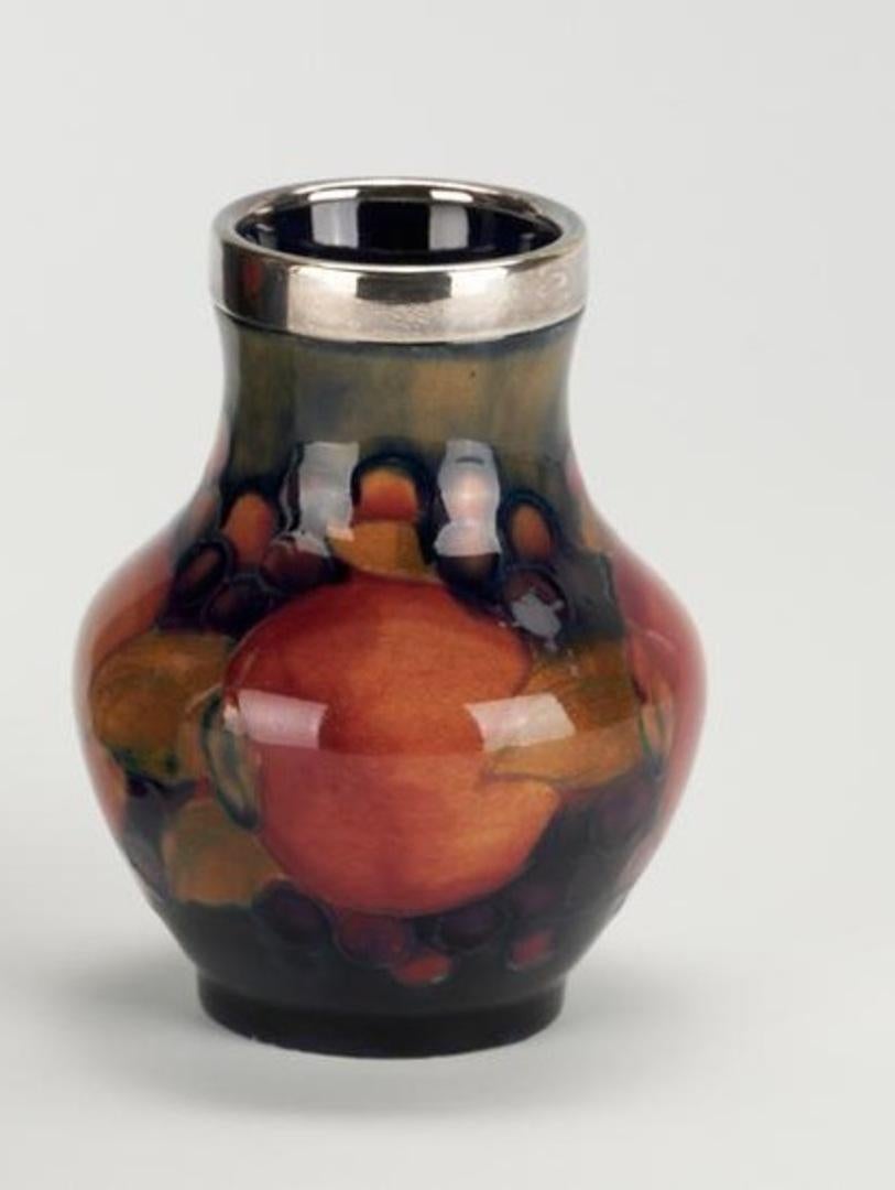 Glazed Art deco Moorcroft POMEGRANATE small vase with silver plated rim. 