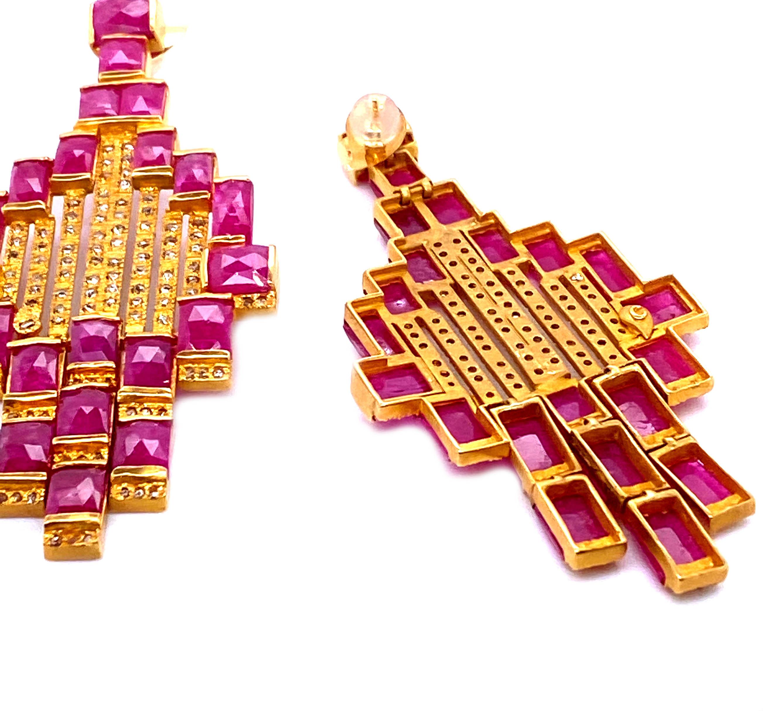 Coomi designs the bold and radiant Art Deco style and Mosaic Ruby Drop earrings from the Luminosity Collection. This collection represents and consists of bold design and reflects light from within each uniquely natural rose cut diamond, and