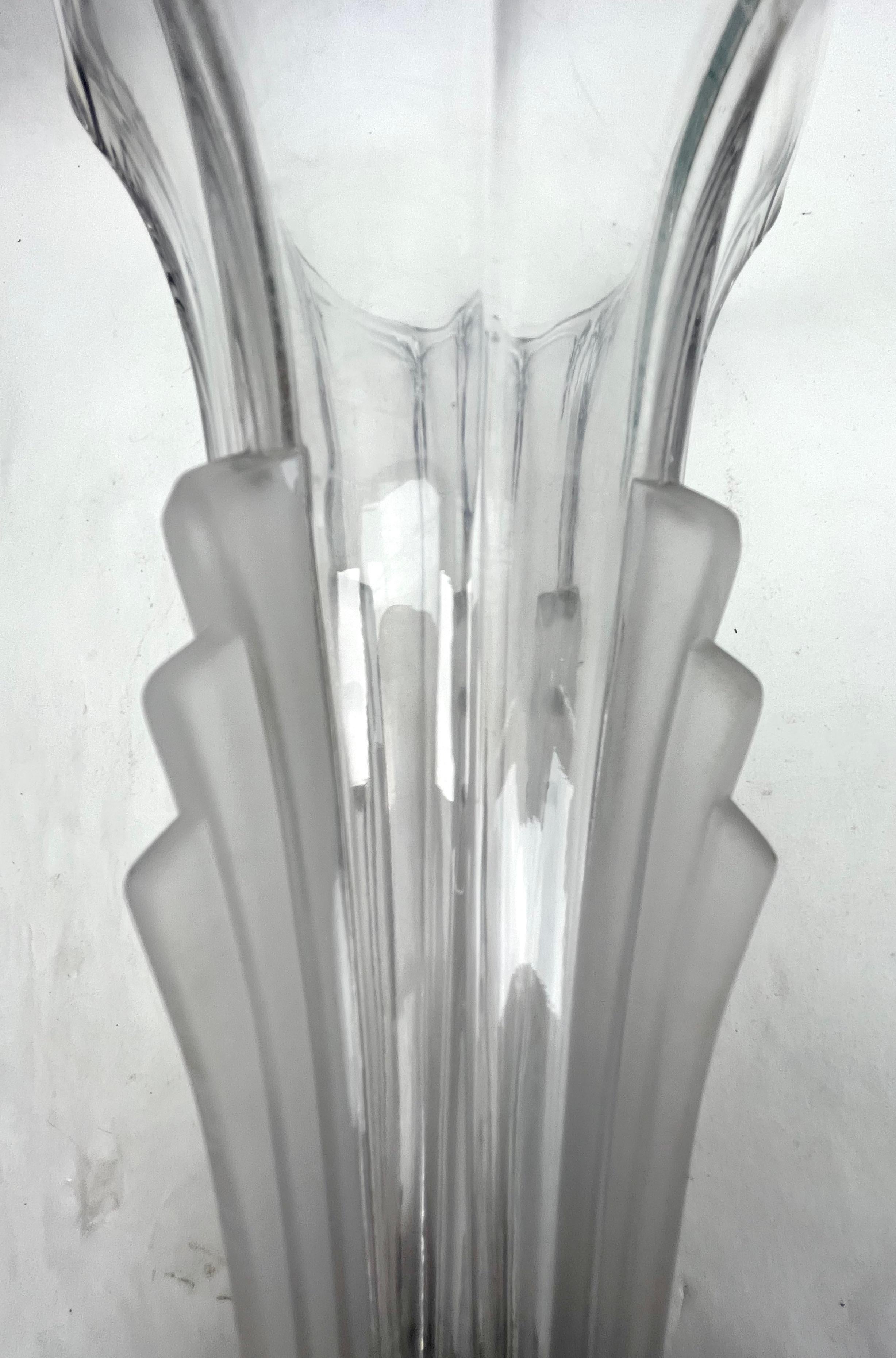 Art Deco Moulded glass vase, Czechoslovakia 1930s

Art Deco molded-glass vase from the 1930s 
A superb, well-made molded-glass vase produced in Czechoslovakia. 
A very Art Deco shape with curved glass and straight vertical lines.

The piece is in