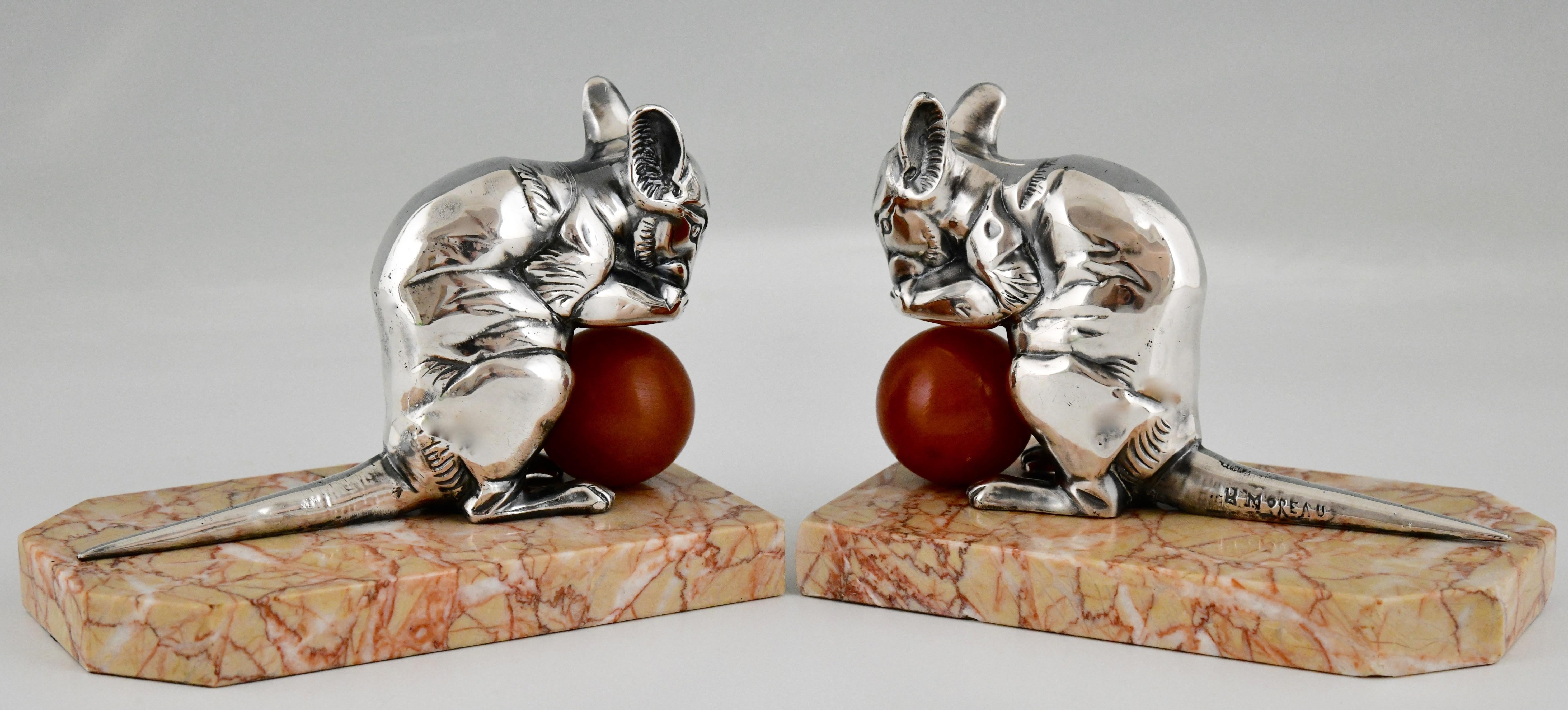 Art Deco mouse bookends signed by Hippolyte Moreau. 
Silvered metal mice holding a bakelite ball and mounted on marble bases.
France 1930.